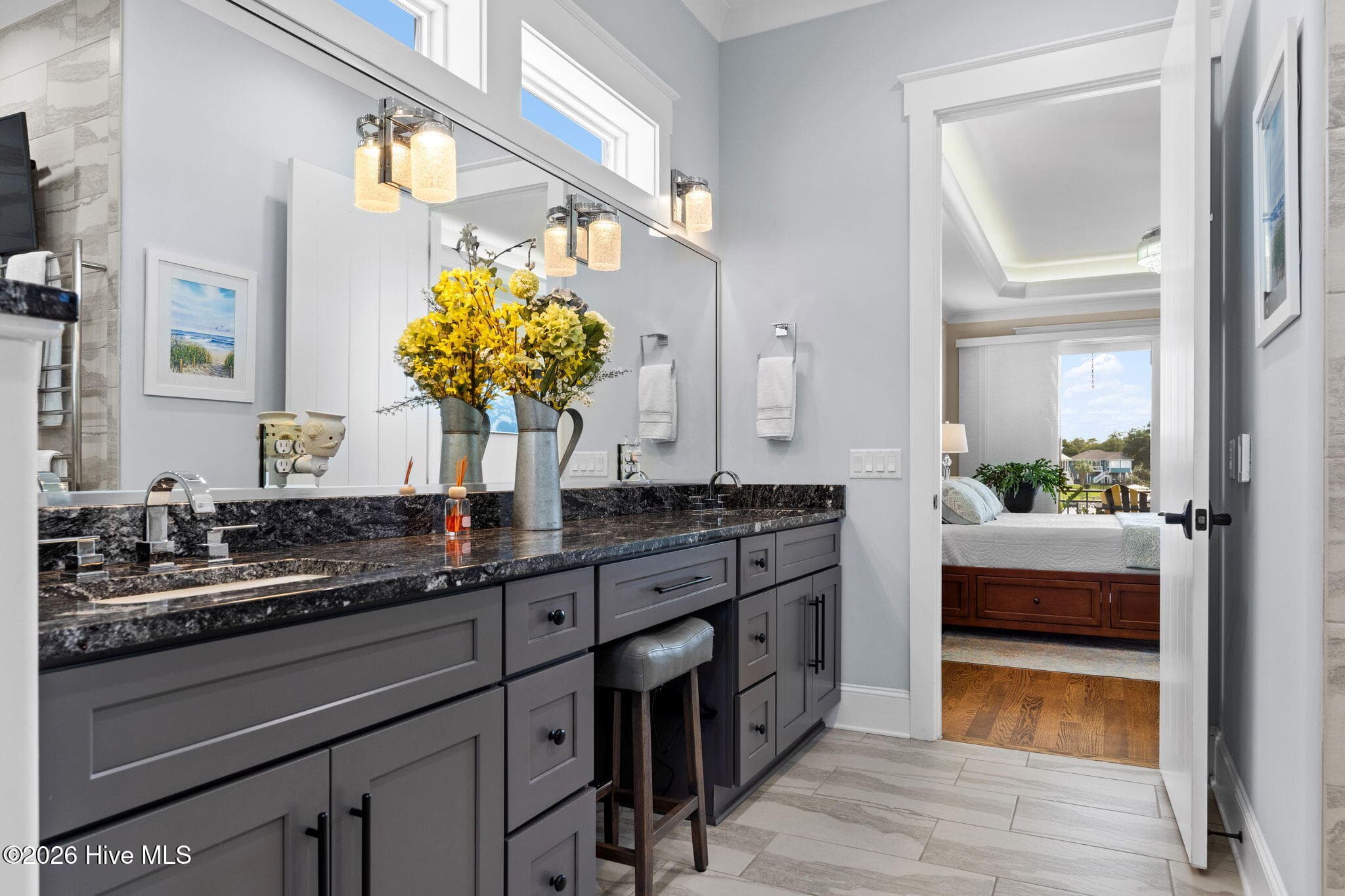 A whole wall of mirror with transom lights above to bring in more natural light - 2775 Long Bay Drive SE, Southport, NC 28461