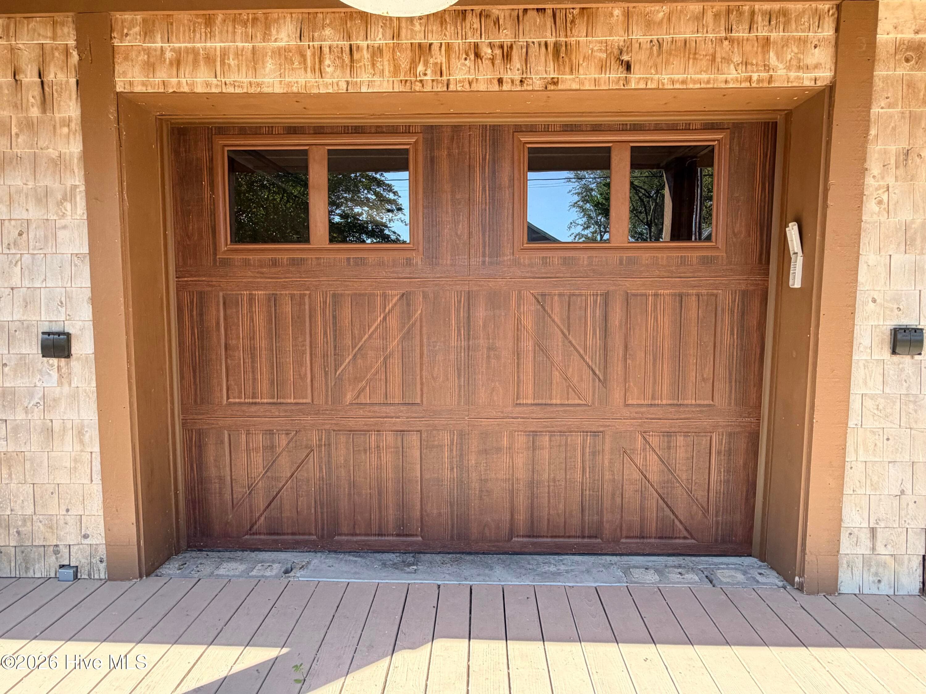 garage doors to downstairs living area - 2704 Waccamaw Shores Road, Lake Waccamaw, NC 28450