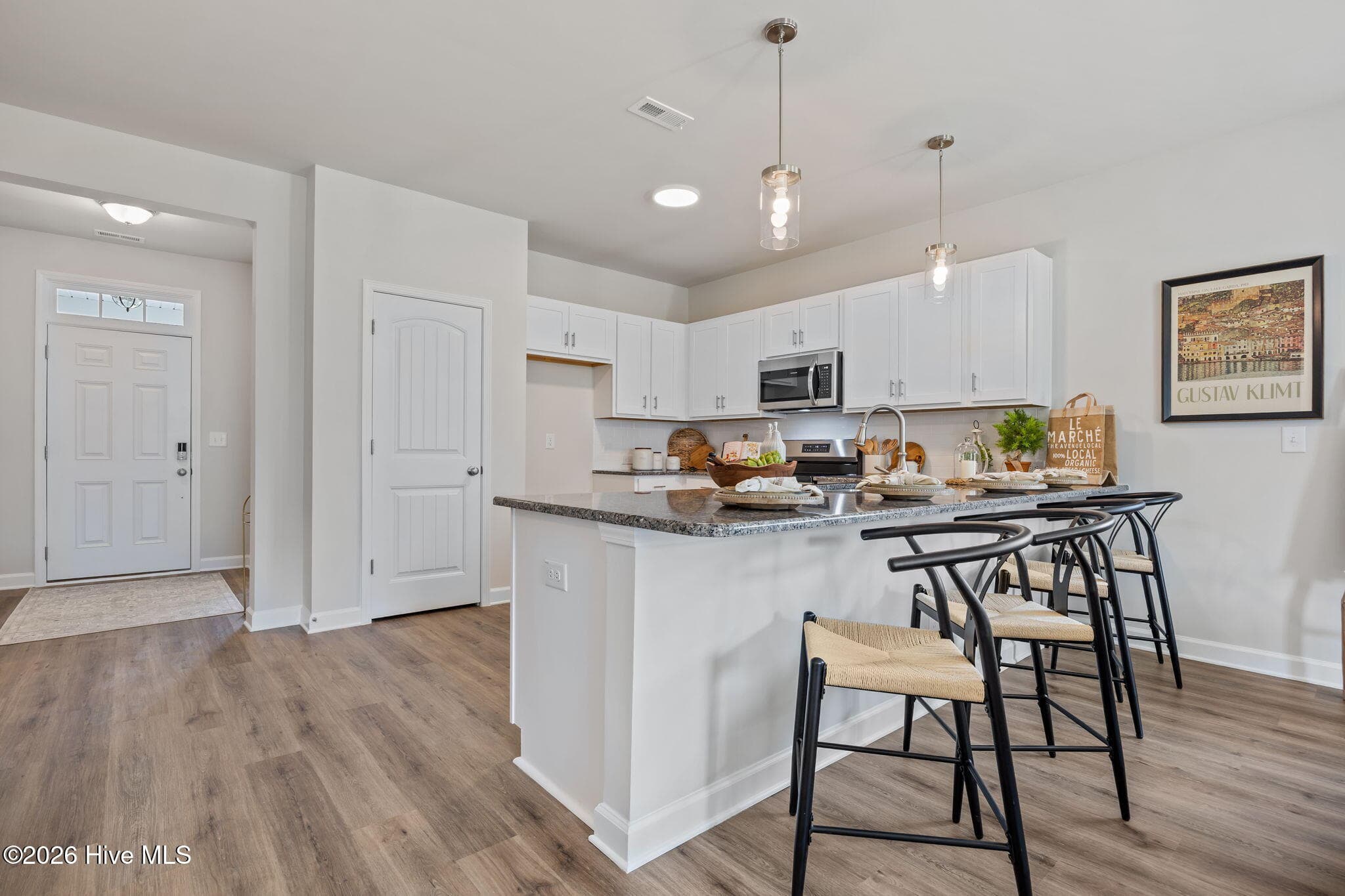 Example photo of similar home with staging. Actual home is under construction. - 4192 Workman Loop 90, Leland, NC 28451