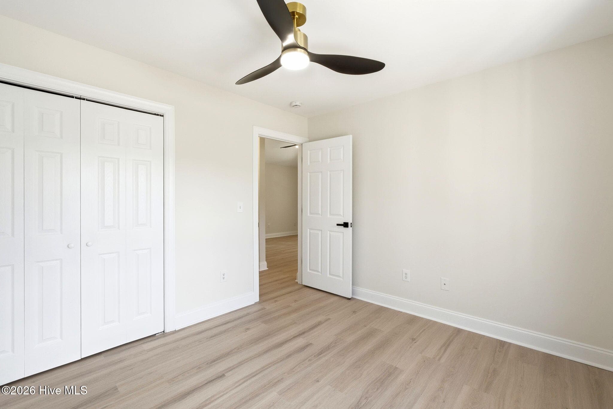 Front Bedroom towards the hallway - 215 Gardenview Court NE, Leland, NC 28451
