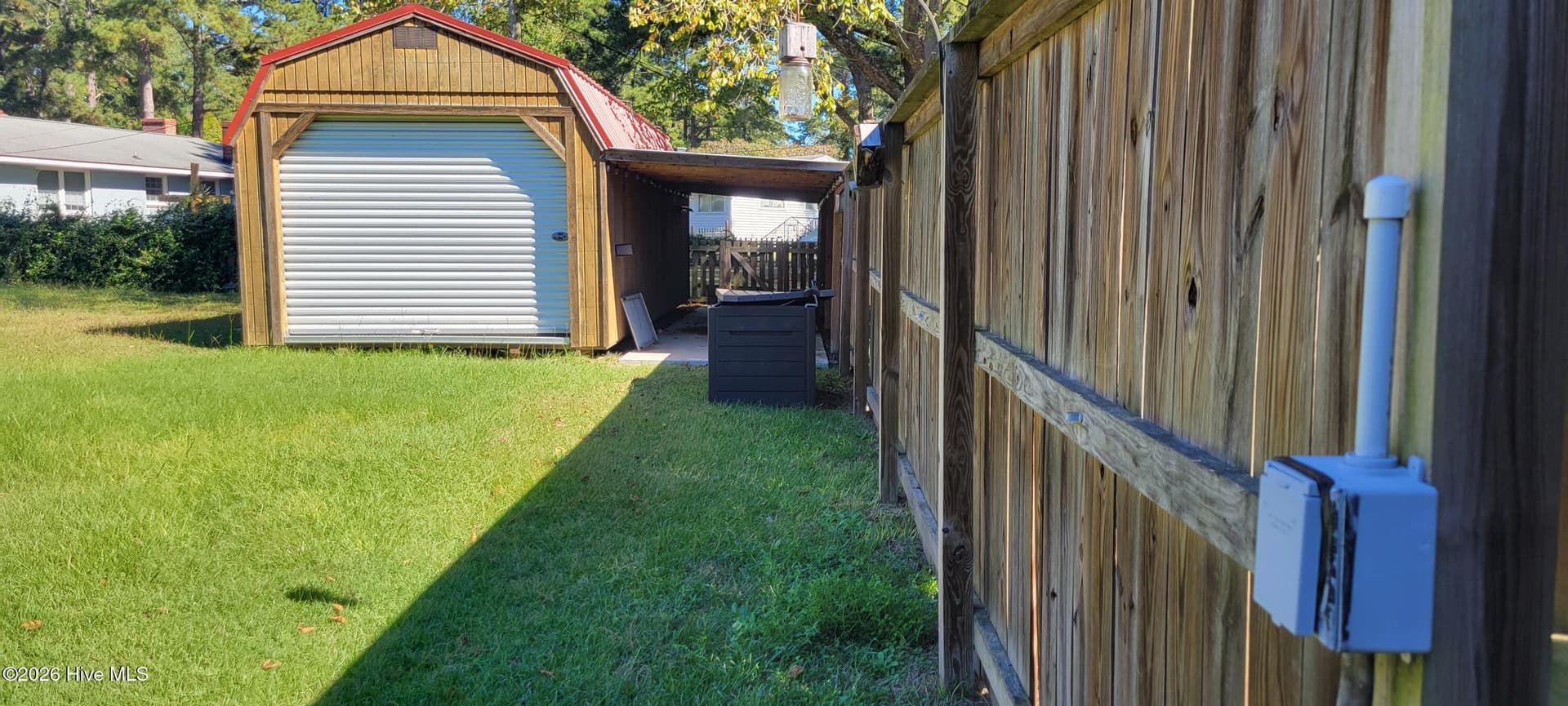 Storage Barn with lean-to and receptacle on fence for RV hookup - 110 Landon Drive, Washington, NC 27889