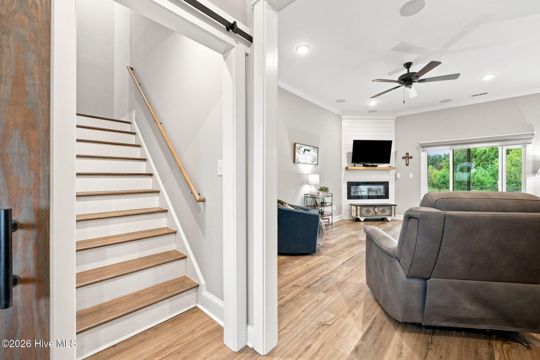Sliding barn door to the upstairs bonus room and wall-in attic space - 2212 Marinwood Court, Greenville, NC 27834
