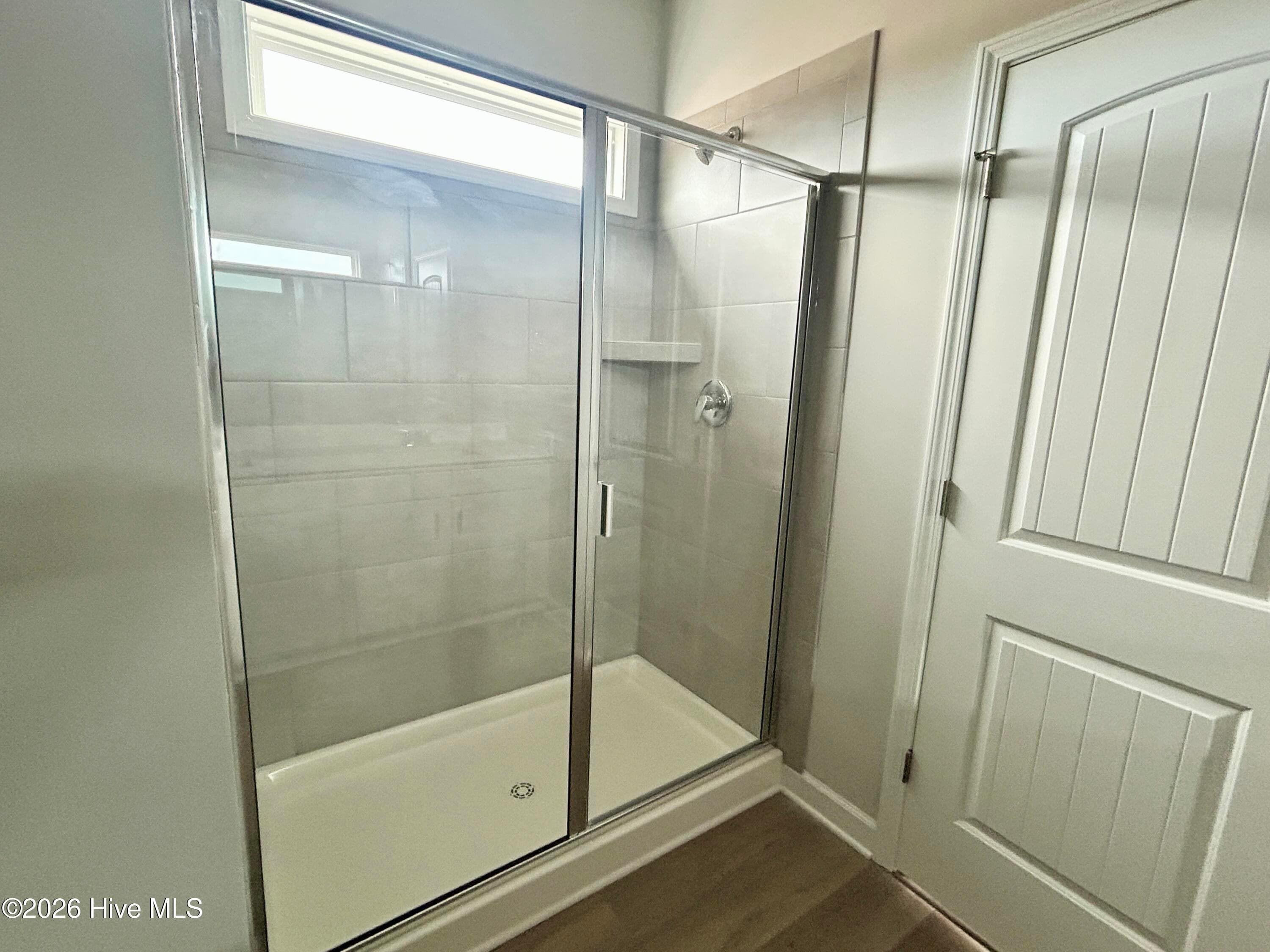 Primary suite features a Private Bathroom with Tile Shower and Large Walk-in Closet - 4212 Workman Loop 95, Leland, NC 28451