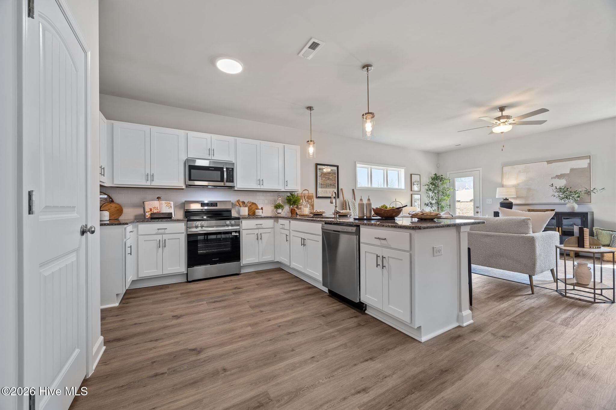Example photo of similar home with staging. Actual home is under construction. - 4192 Workman Loop 90, Leland, NC 28451