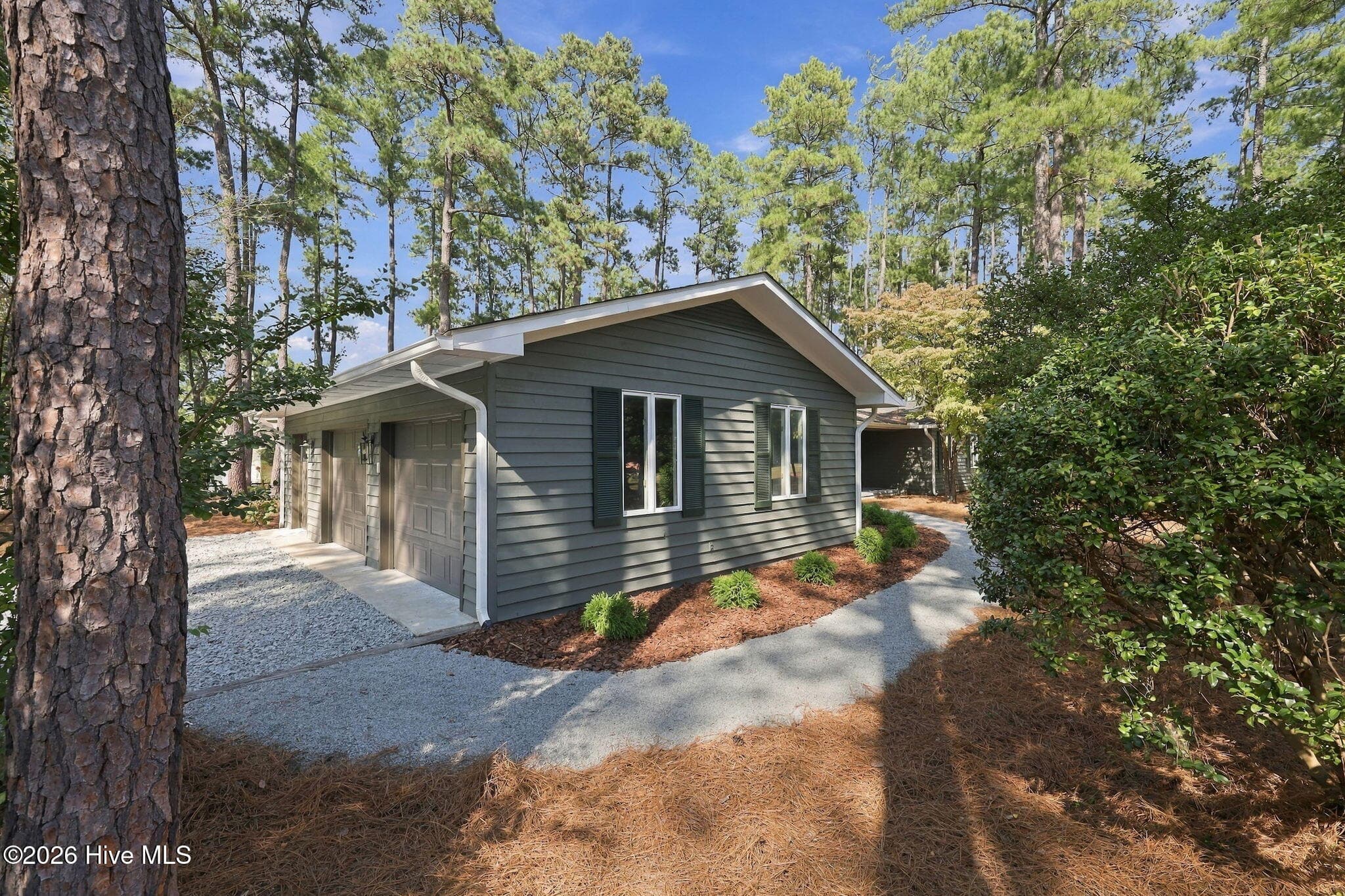 large 2 car garage with separate golf cart bay - 84 Richmond Road, Jackson Springs, NC 27281