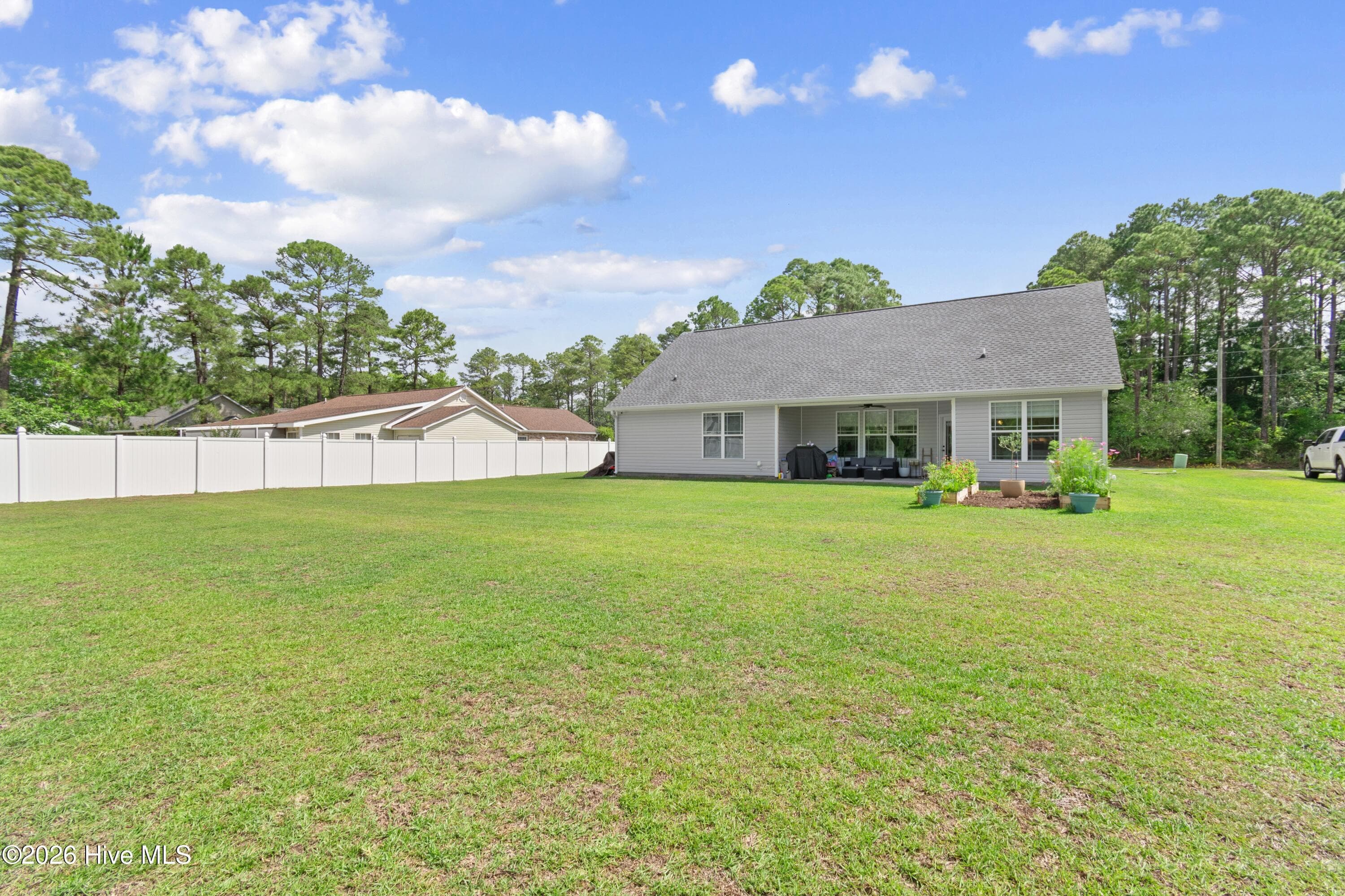The rear yard offers endless possibilities for outdoor living and enjoyment. Whether you envision weekend gatherings, a play area, gardening space, or simply a peaceful place to relax, this versatile backyard provides the perfect canvas. With plenty of room for pets, entertaining, or even a future patio, fire pit, or swimming pool, the possibilities are truly endless. - 299 Boundaryline Drive NW, Calabash, NC 28467