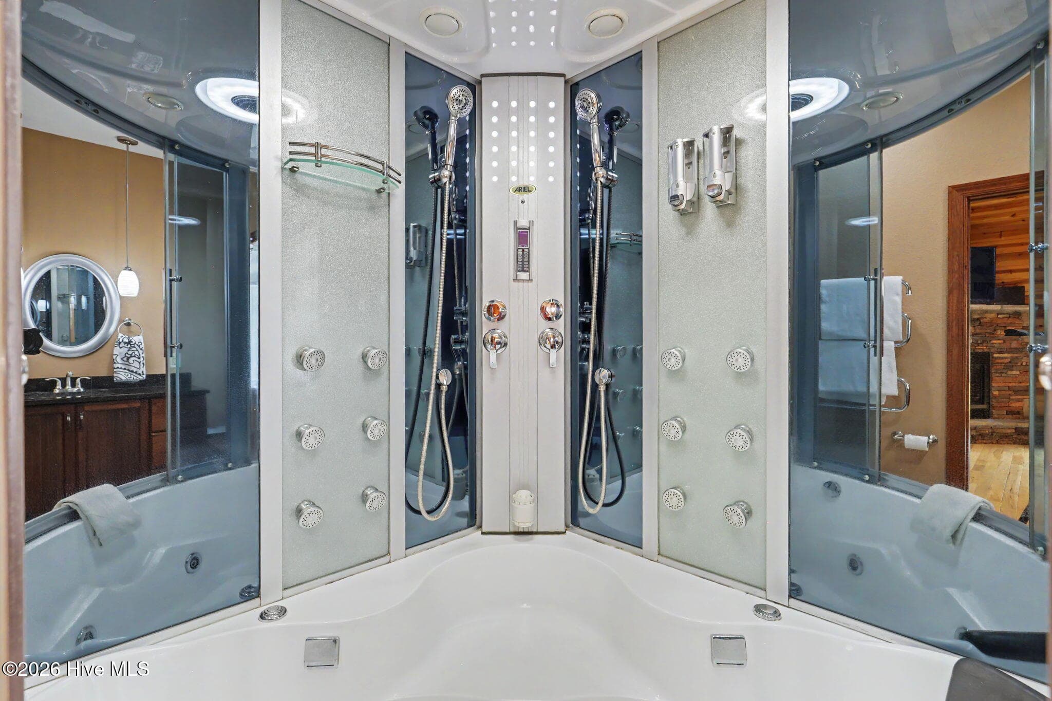 Luxury steam and rain shower with multiple body sprays enhance the spa-like experience of the master suite. - 210 Majestic Drive, Hayesville, NC 28904
