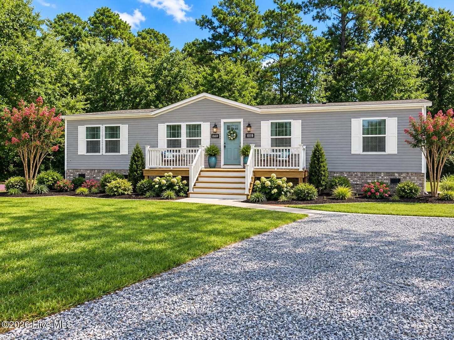 With the help of AI see what a porch and landscaping can do to make this your dream home! - 9115 E Calabash Drive SW, Calabash, NC 28467