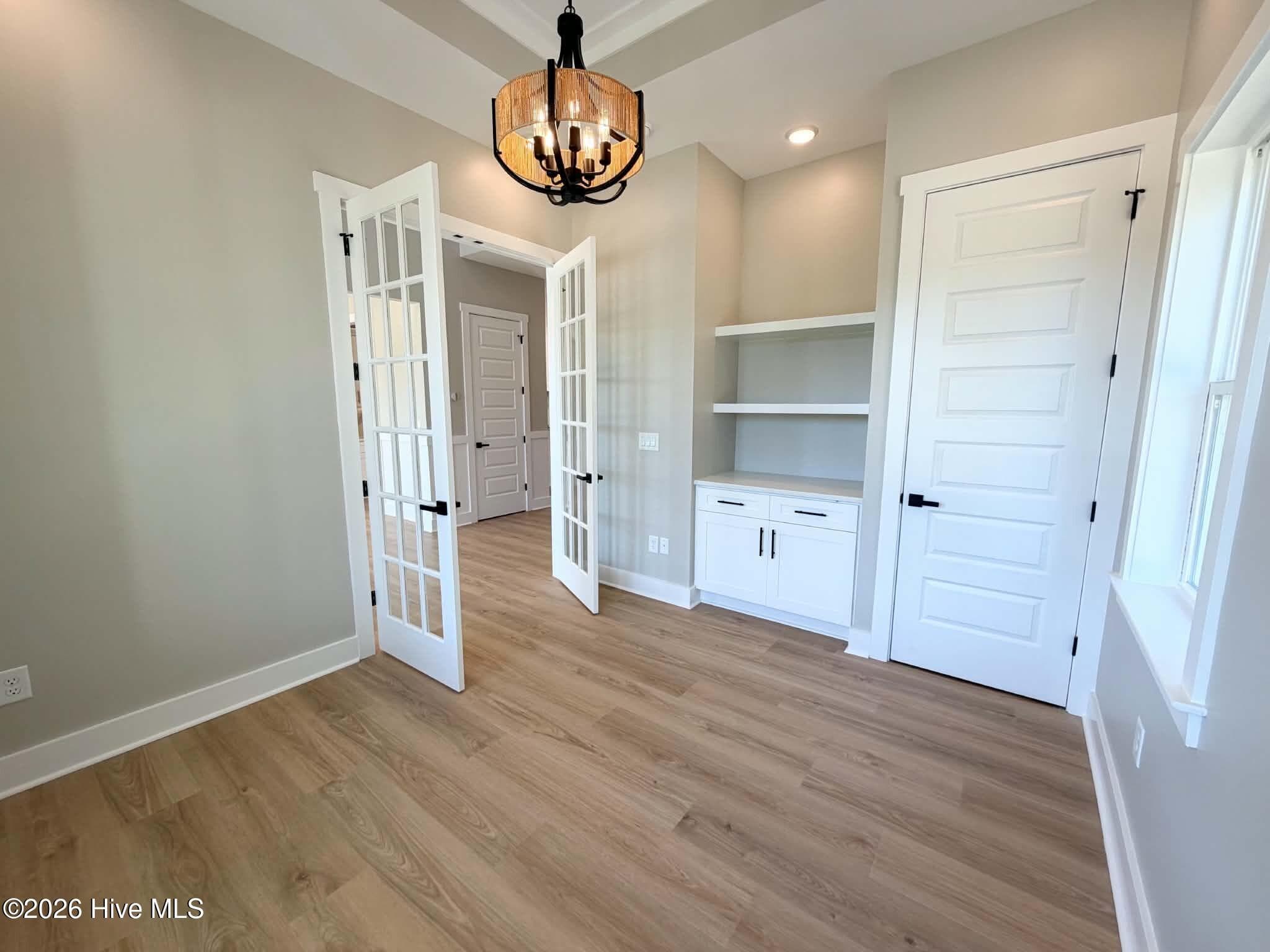 Home office main level custom lighting, trey ceiling and built-ins. - 550 Glenburnie Street NW, Calabash, NC 28467