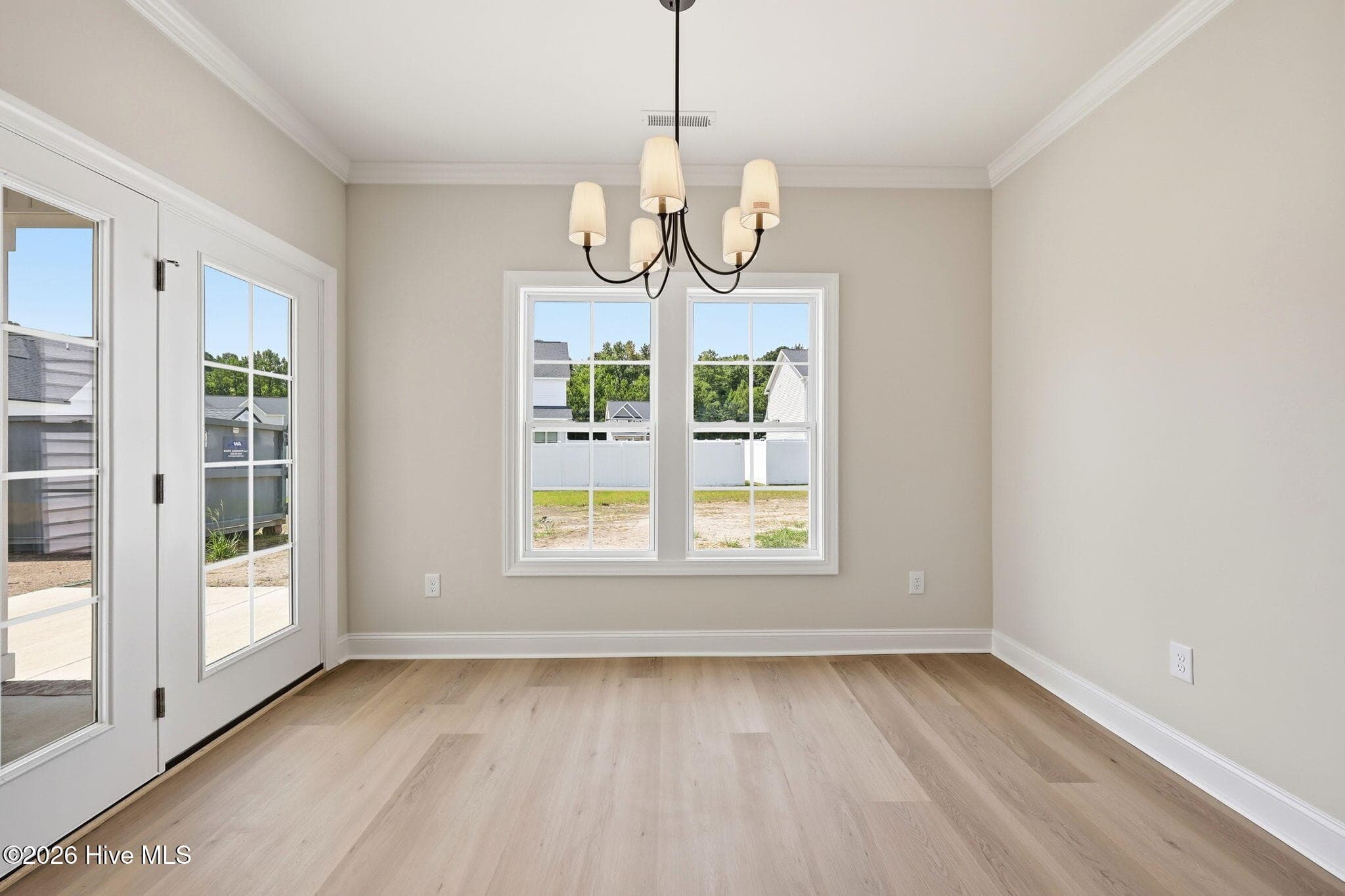 dining has a door to covered patio - windows for great natural lighting - 1005 Finn Court, Greenville, NC 27834