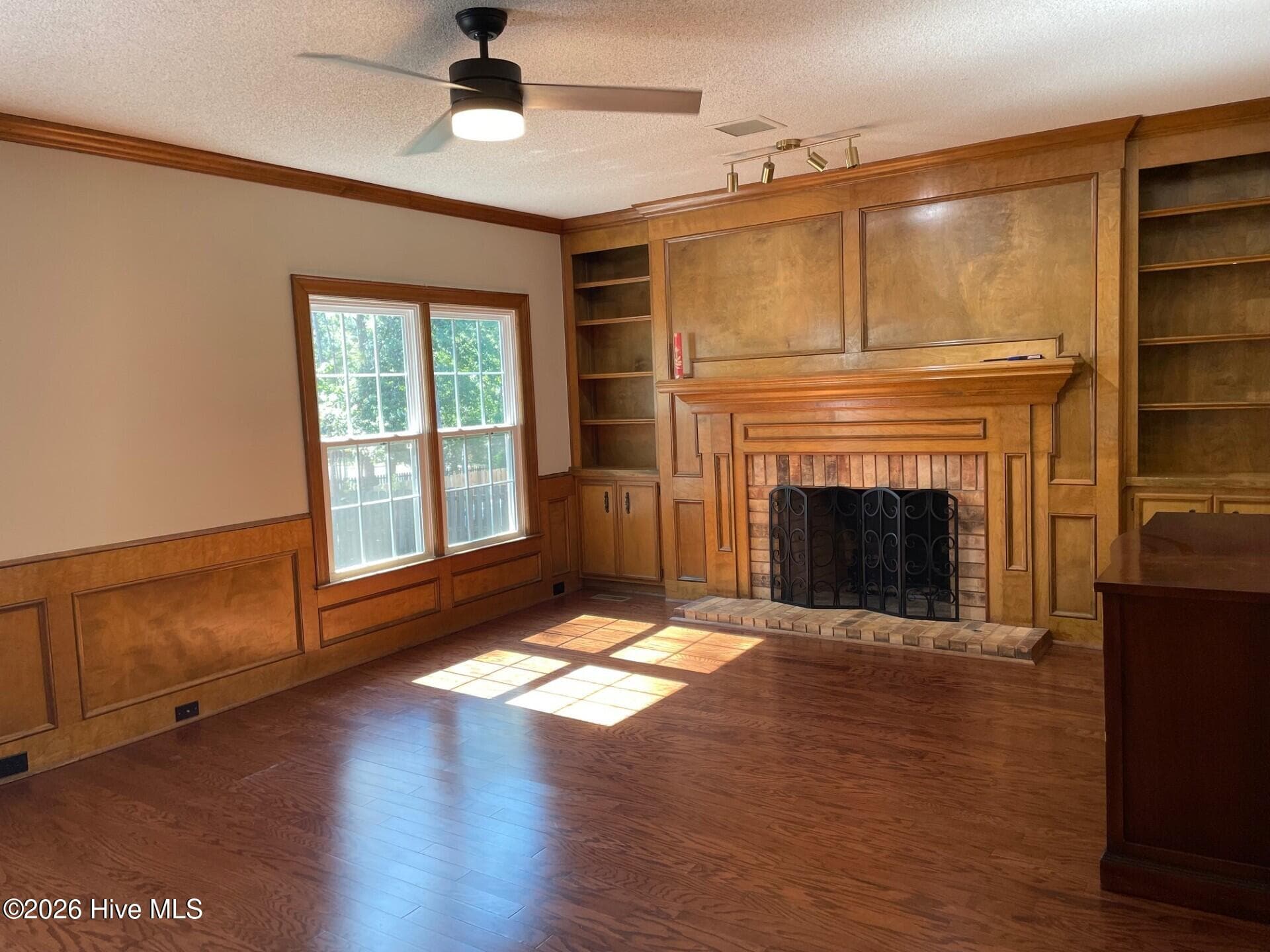 Family Room/Den with built-ins and gas log fireplace. New flooring 2024. - 4164 Quail Springs Circle, Augusta, GA 30907