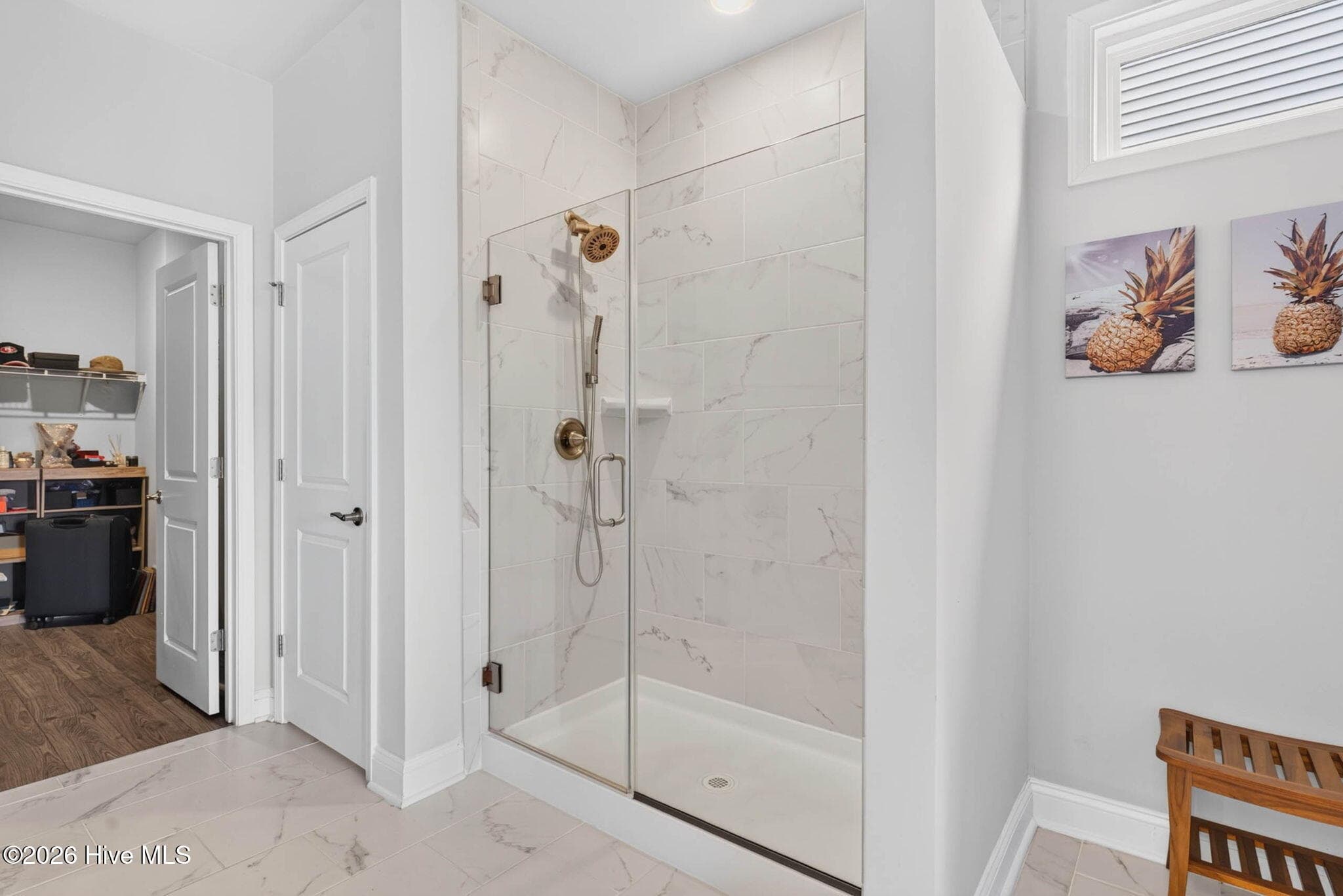 The primary bathroom features a relaxing soaking tub, separate walk-in shower, and neutral tile finishes. - 139 Eagle Claw Drive, Calabash, NC 28467