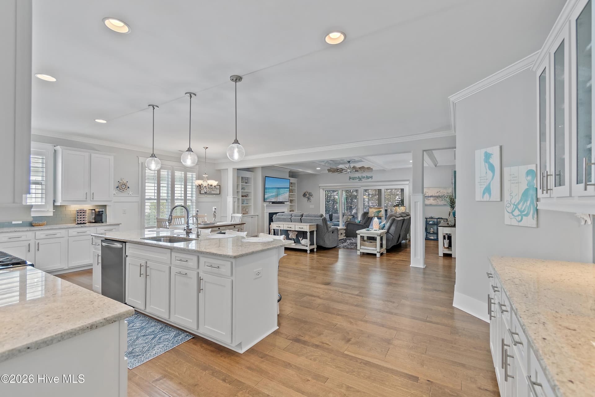 Open floor plan with large spaces. Recessed lighting, granite countertops, pendant lighting, upgraded woodwork throughout. - 6358 Bryson Drive SW, Ocean Isle Beach, NC 28469