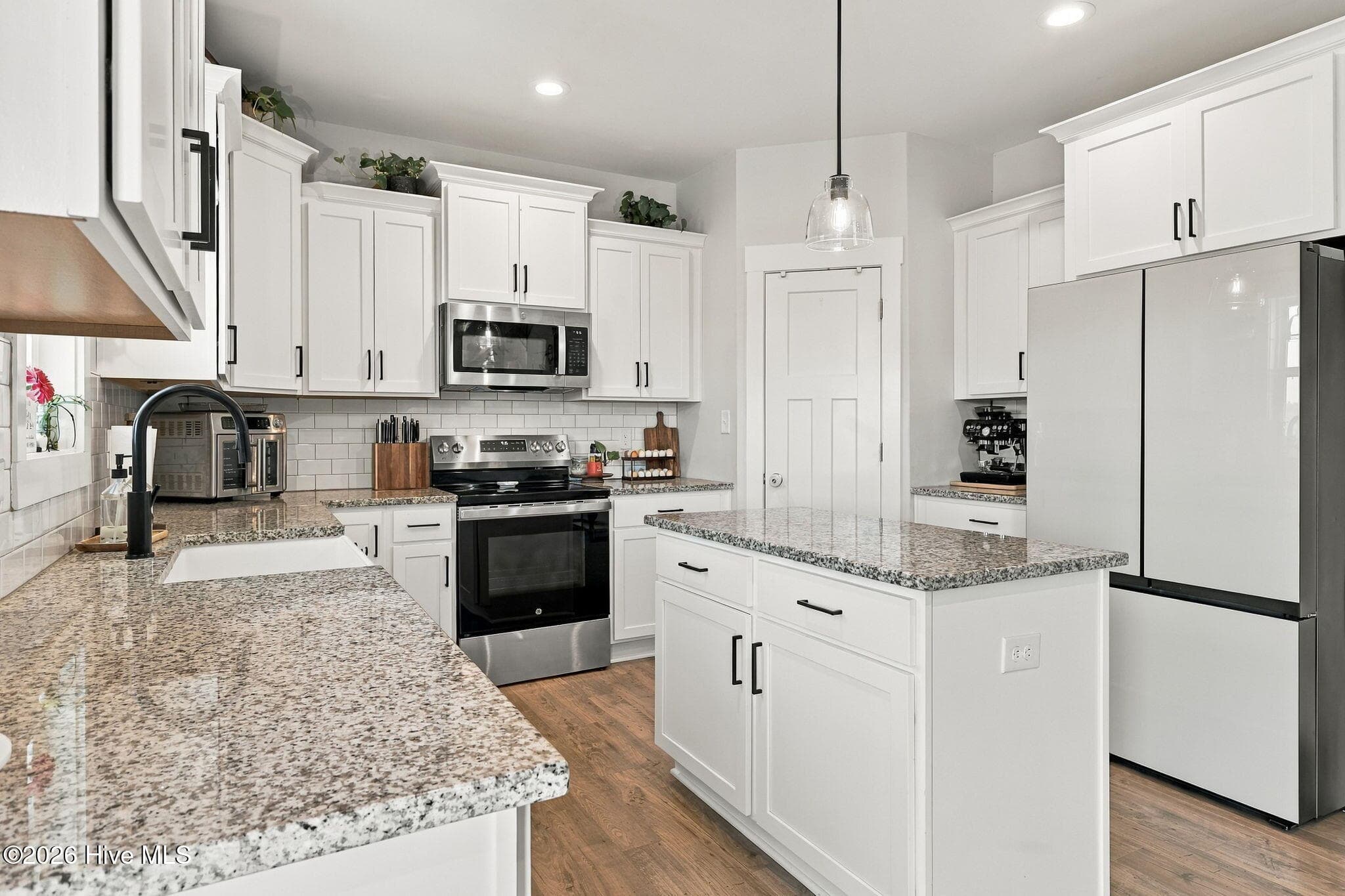 Stainless steel appliances with a deep farmhouse sink that overlooks your homestead. - 1400 Chason Road, Lumber Bridge, NC 28357