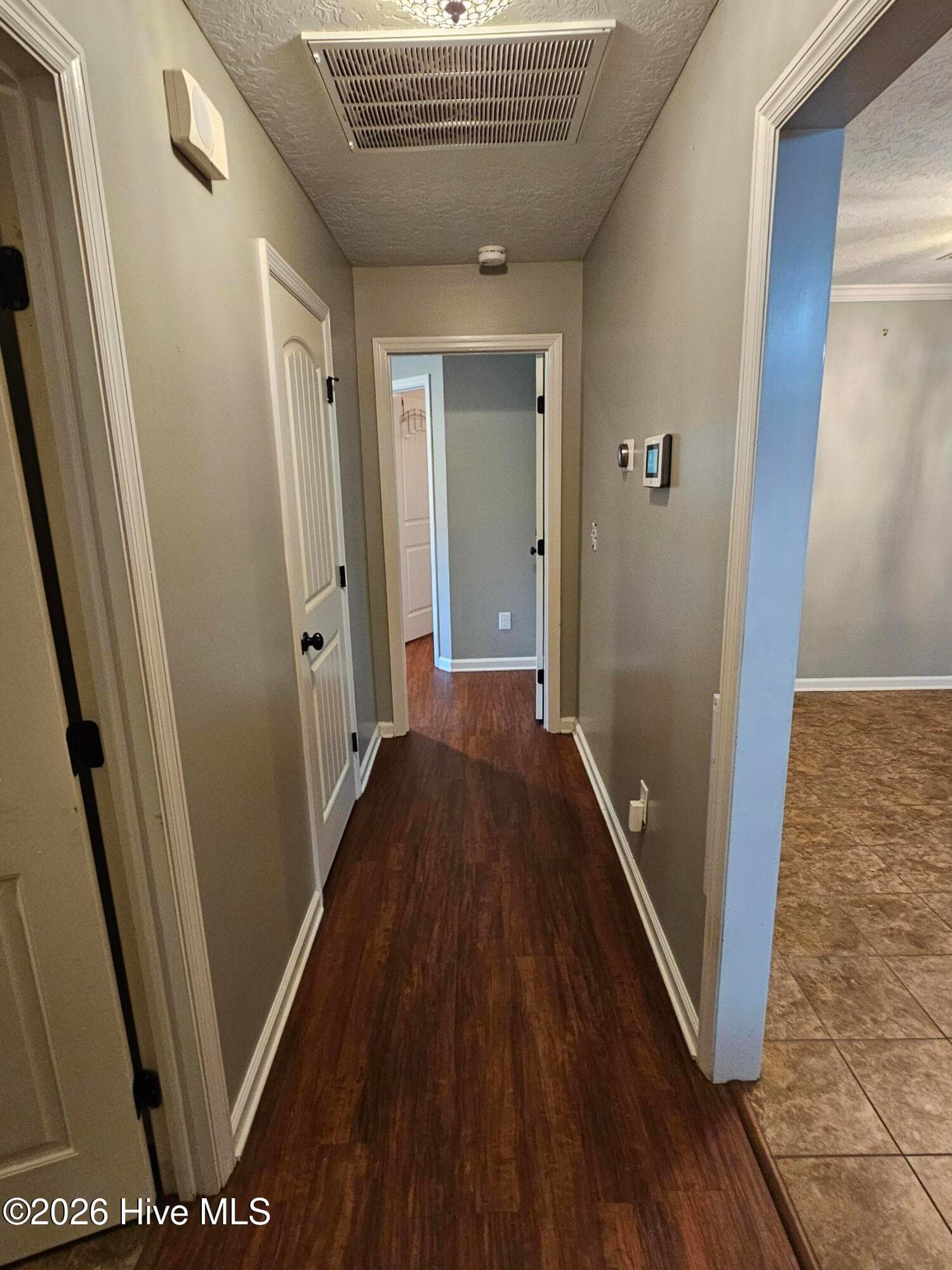 Hallway to Laundry room and Owner's suite - 115 Kim Court, Blythe, GA 30805