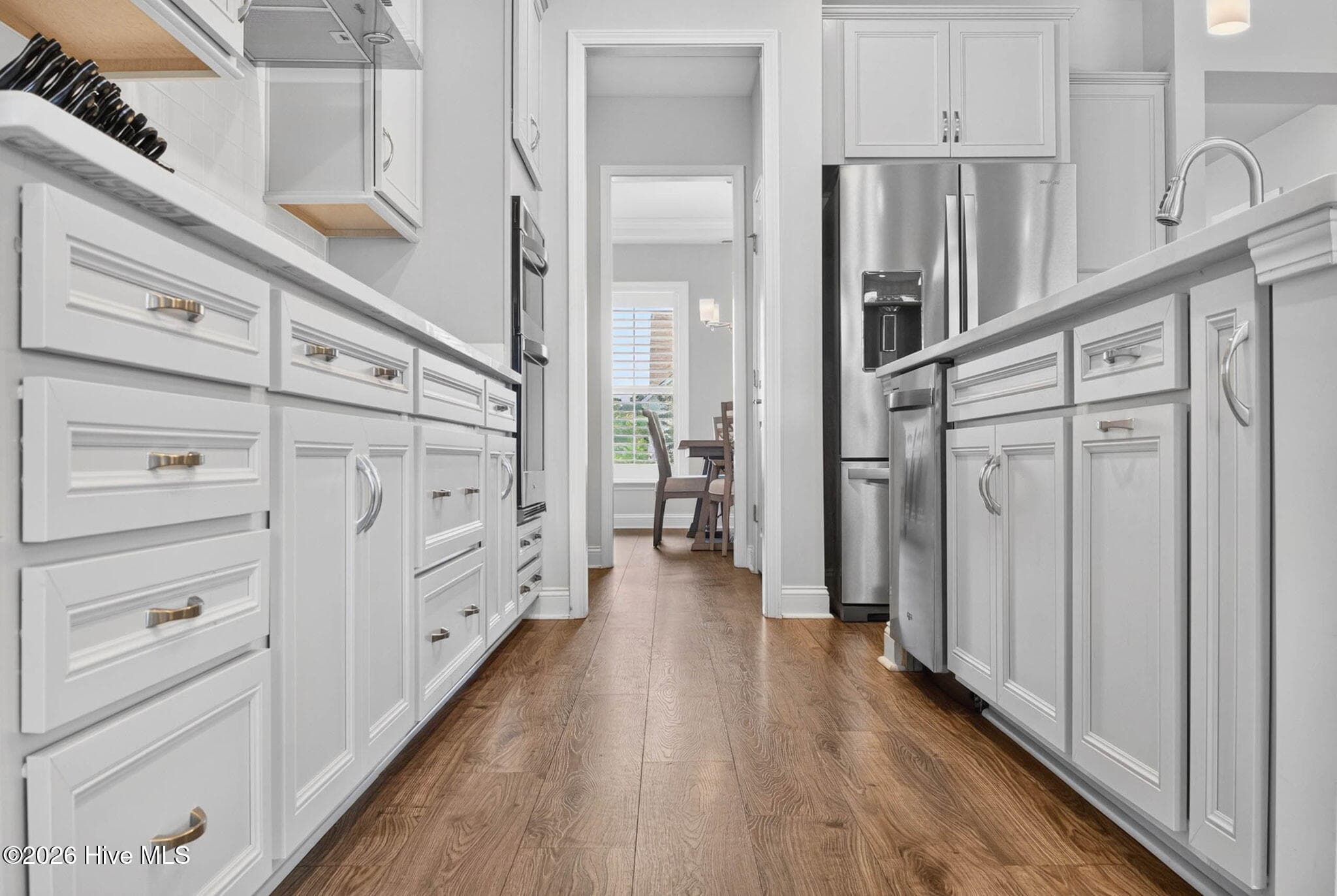 Bright cabinetry, generous workspace, and thoughtful storage make this spacious kitchen both stylish and functional. - 139 Eagle Claw Drive, Calabash, NC 28467