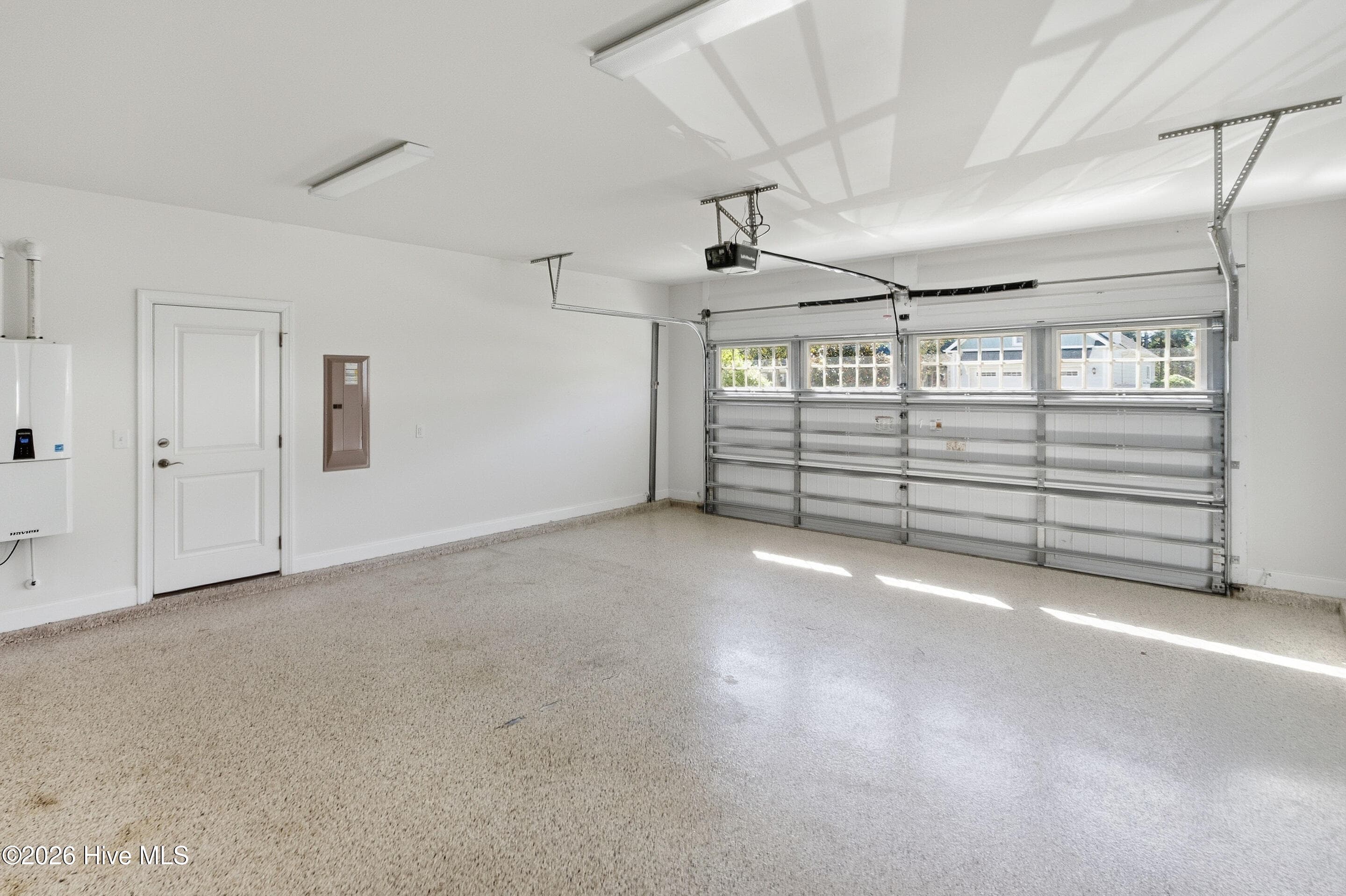 Extra large garage with access door and tankless water heater - 2153 Forest View Circle, Leland, NC 28451
