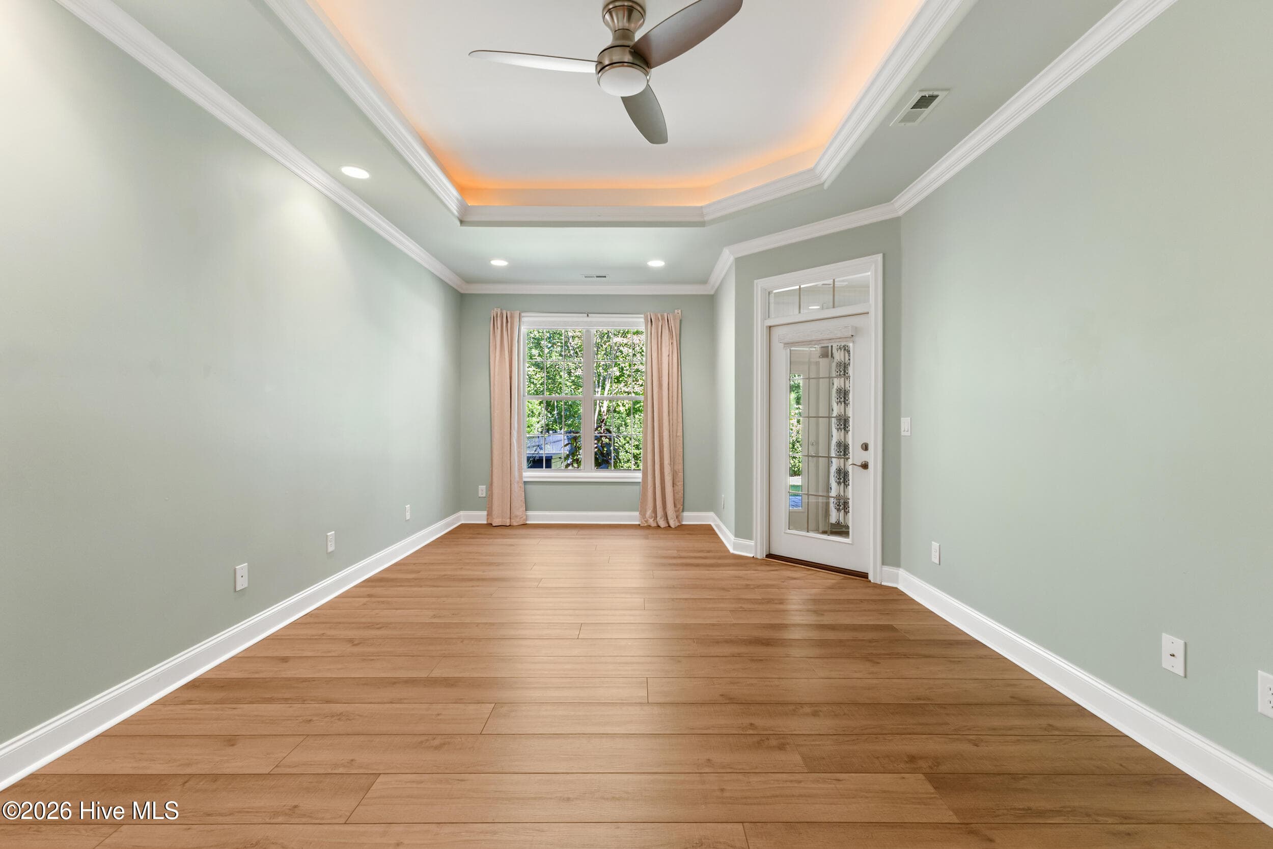 Primary Bedroom with door to sunroom - 615 Jenoa Drive, Castle Hayne, NC 28429