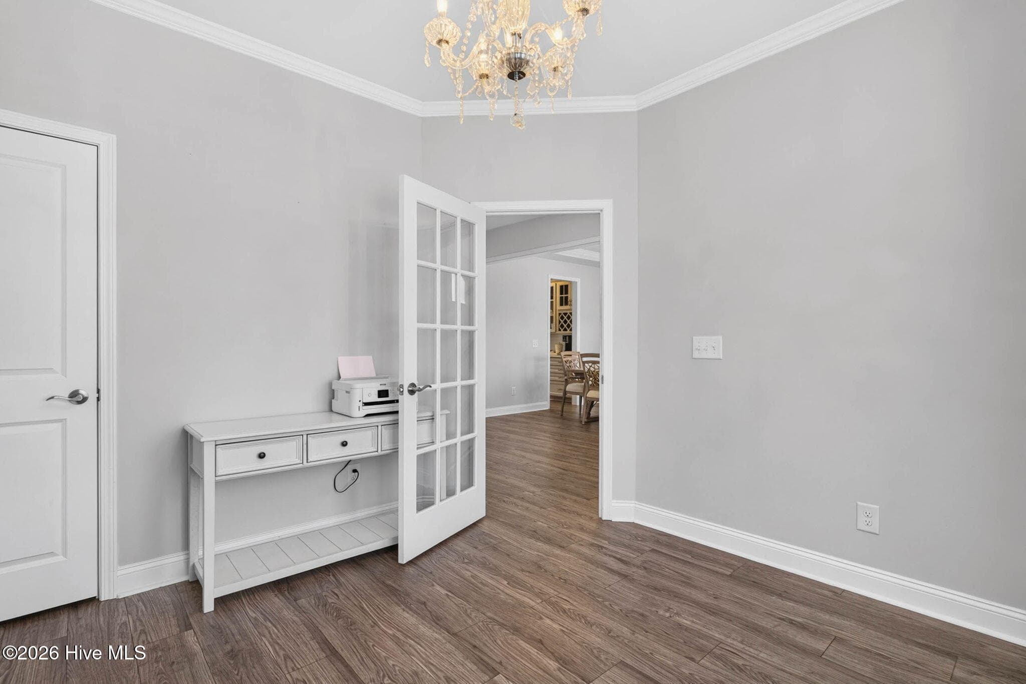 Another view of the main-level office highlights its generous size, built-in storage, and connection to the foyer. - 139 Eagle Claw Drive, Calabash, NC 28467