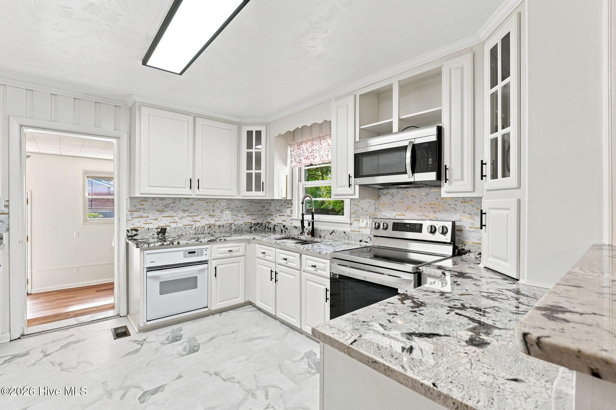 2 electric ovens Light bright kitchen with granite and tile backsplashj - 13280 Blues Farm Road, Laurinburg, NC 28352