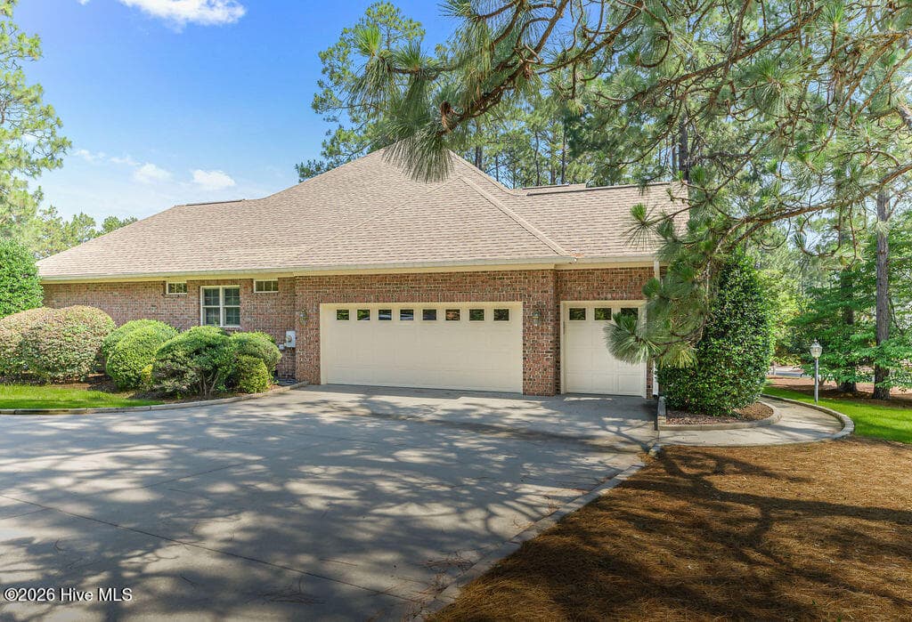 Two-car garage with golf cart bay. - 62 Stoneykirk Drive, Pinehurst, NC 28374