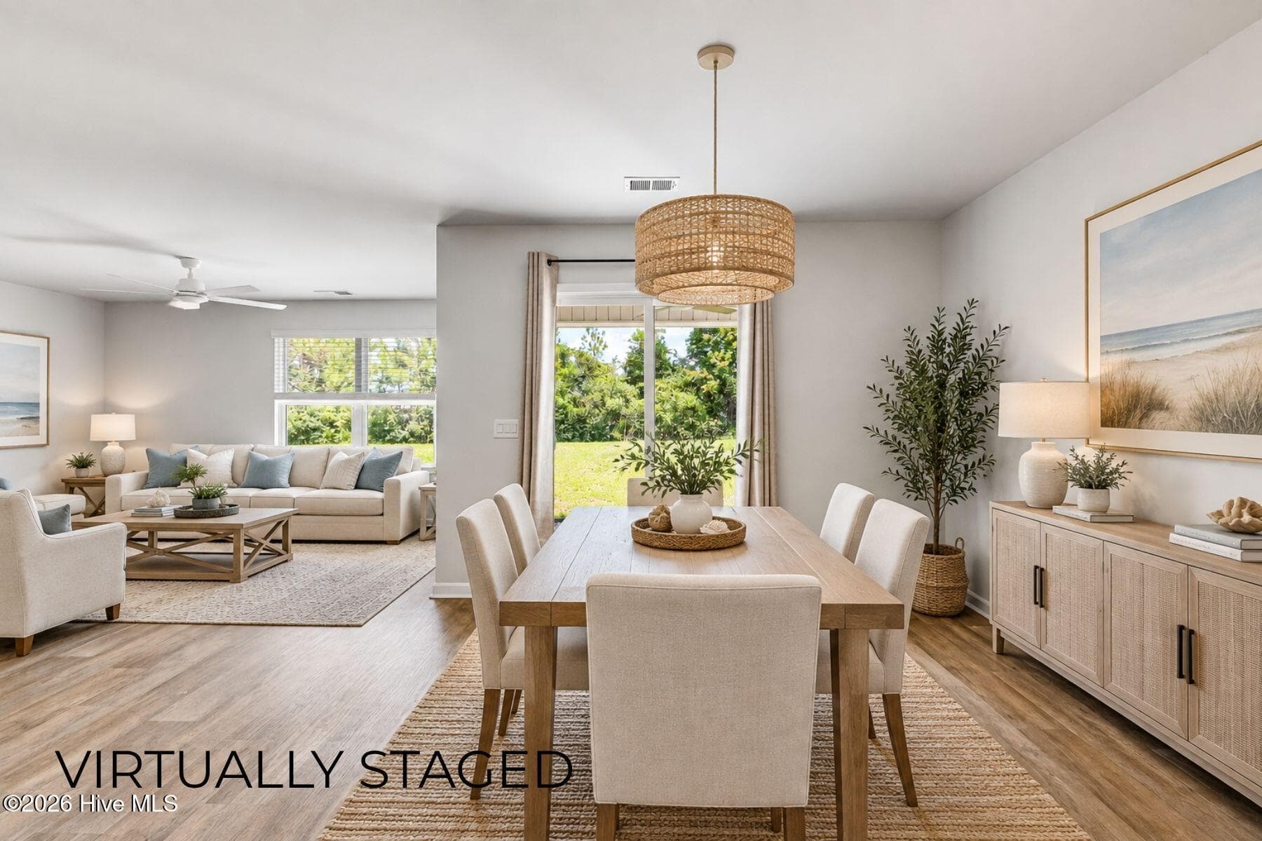 virtually staged dining and living area - 1774 Culdees Lane SE, Bolivia, NC 28422