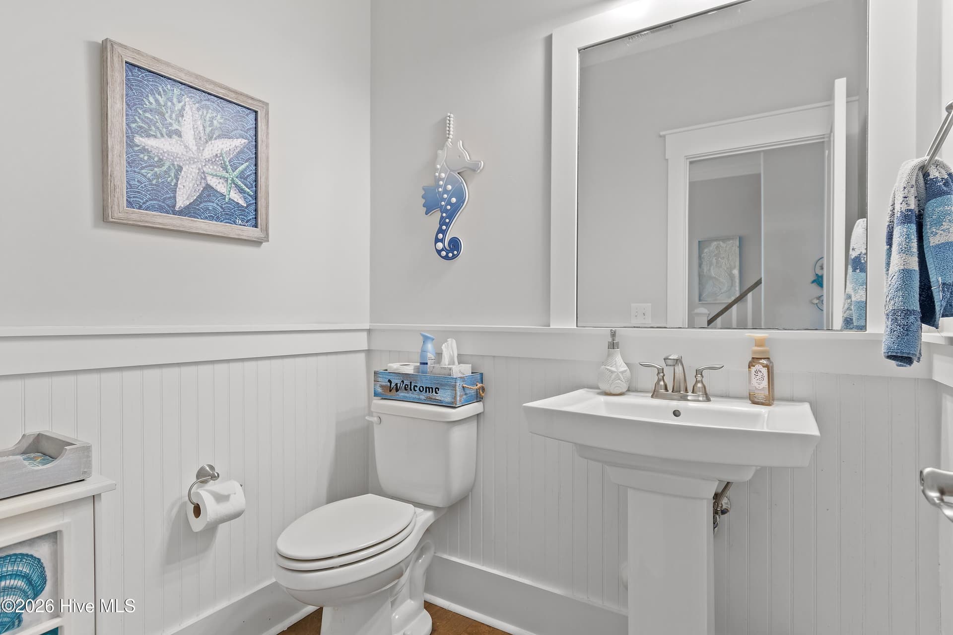 Beadboard in hallway half bath. - 6358 Bryson Drive SW, Ocean Isle Beach, NC 28469