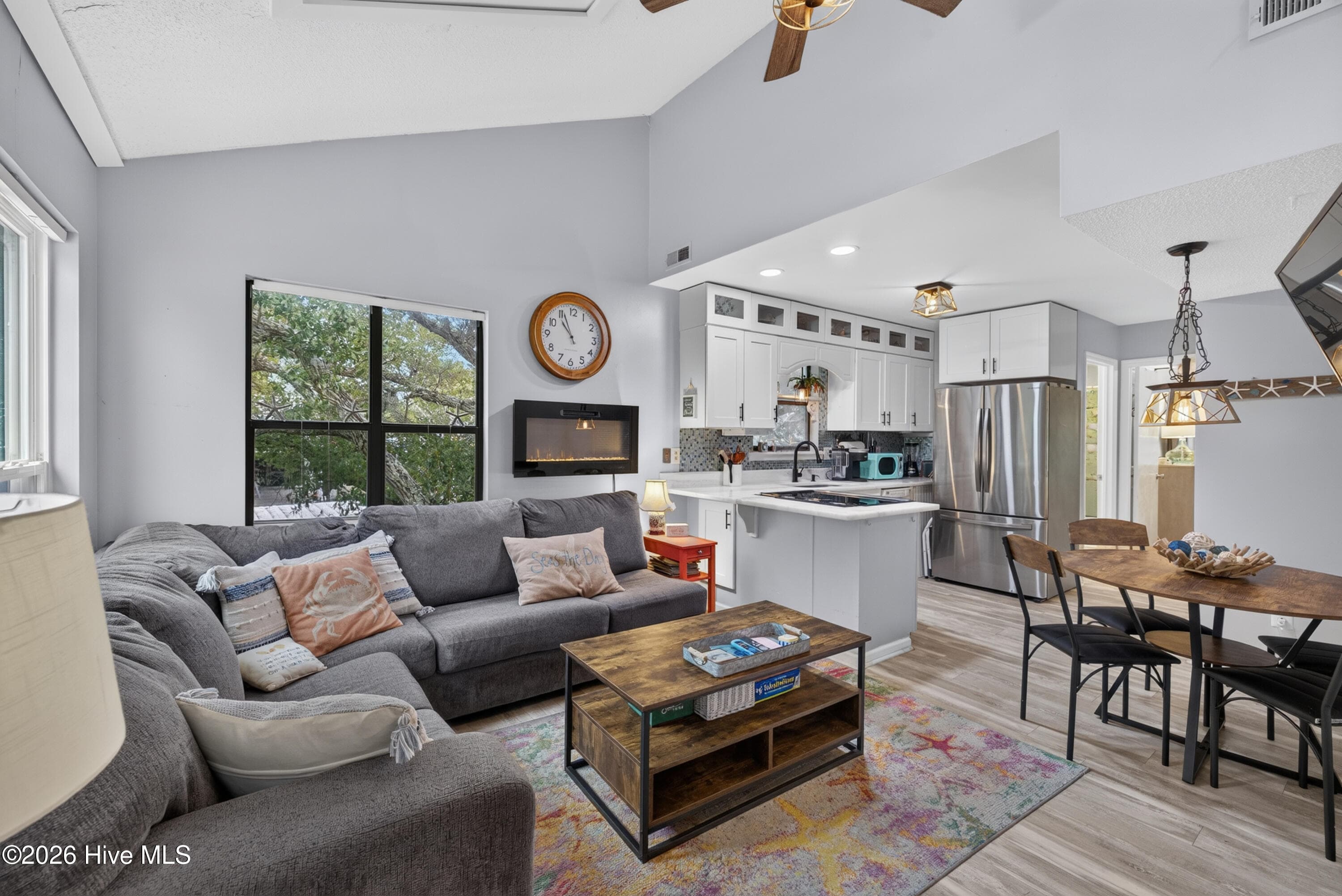 Living area with vaulted ceilings make this unit feel larger. - 301 Bay Circle, North Topsail Beach, NC 28460
