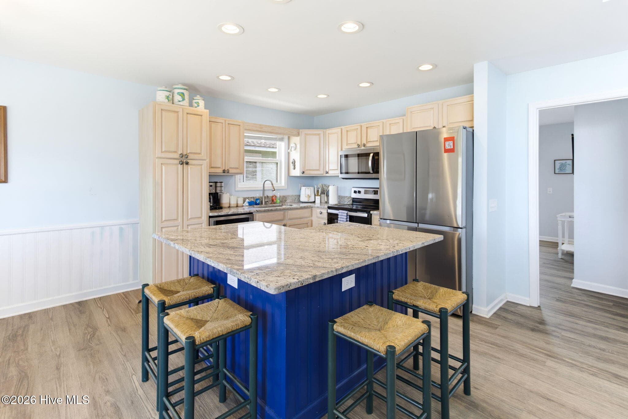 Kitchen island with bar seating - 2330 W Beach Drive, Oak Island, NC 28465