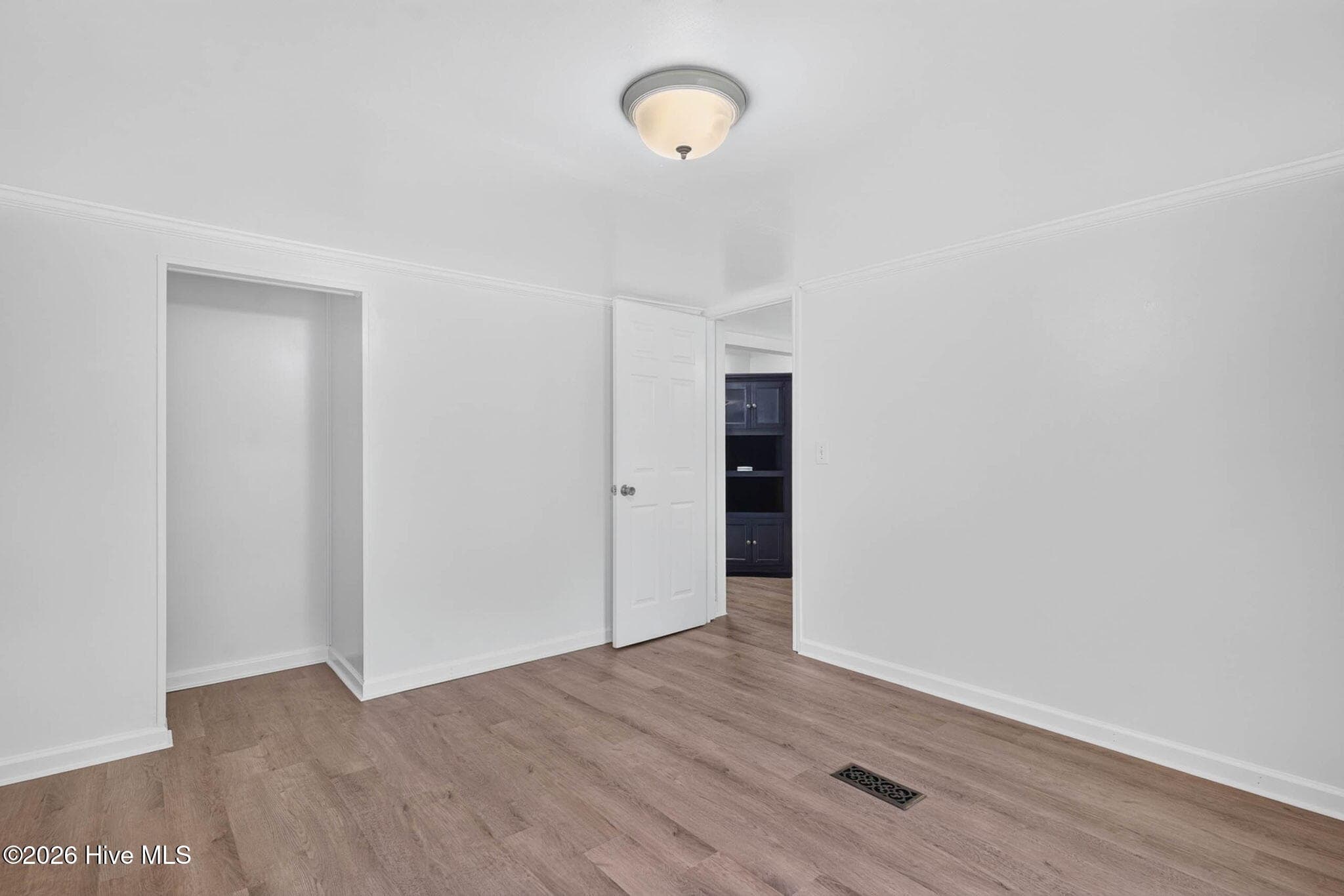 A spacious secondary bedroom with a functional layout, ideal for guests, family members, or a dedicated workspace. - 1199 Zack Street SE, Bolivia, NC 28422