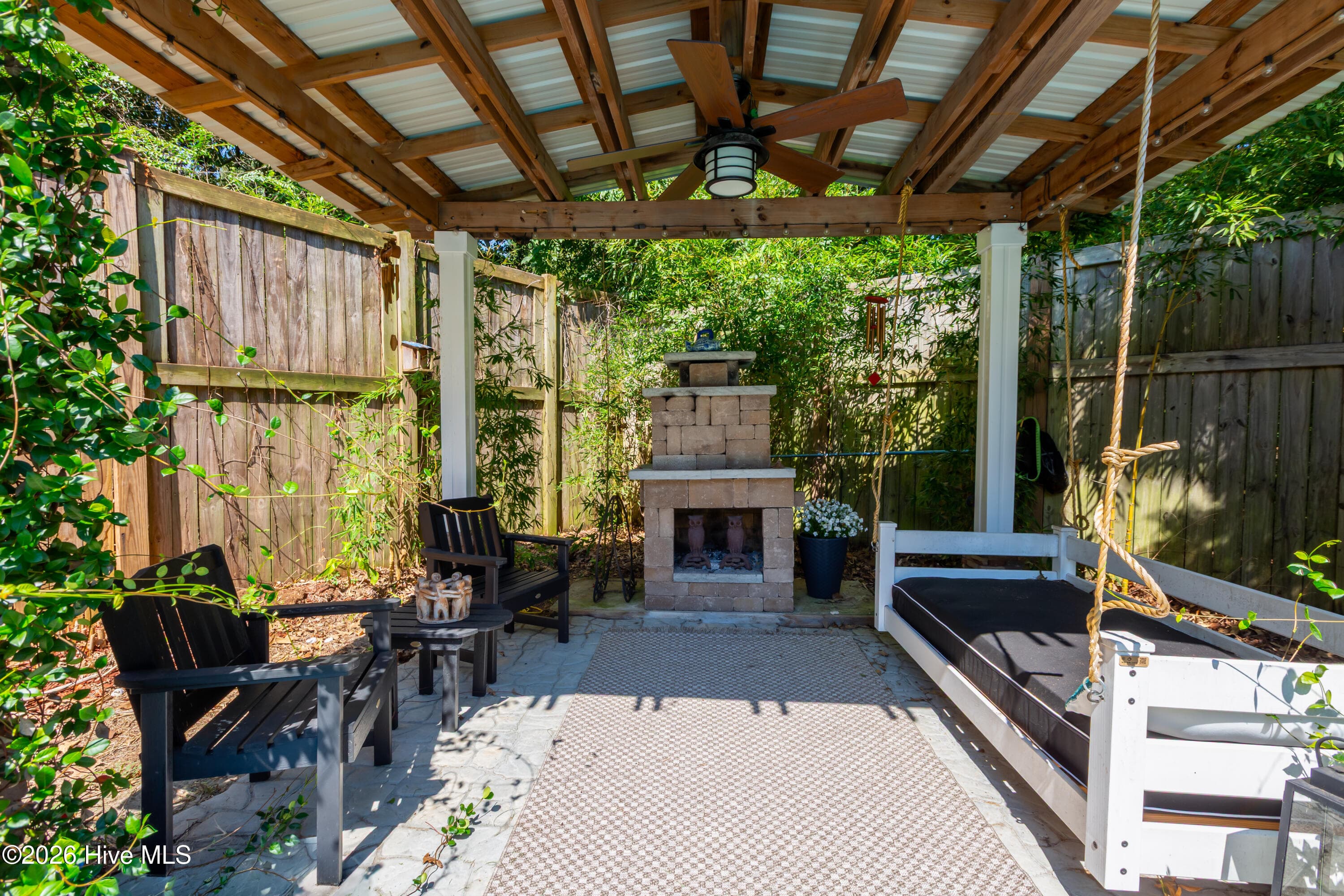 Curl up on the daybed porch swing and enjoy the 2nd fireplace - 2417 Oakview Drive, New Bern, NC 28562