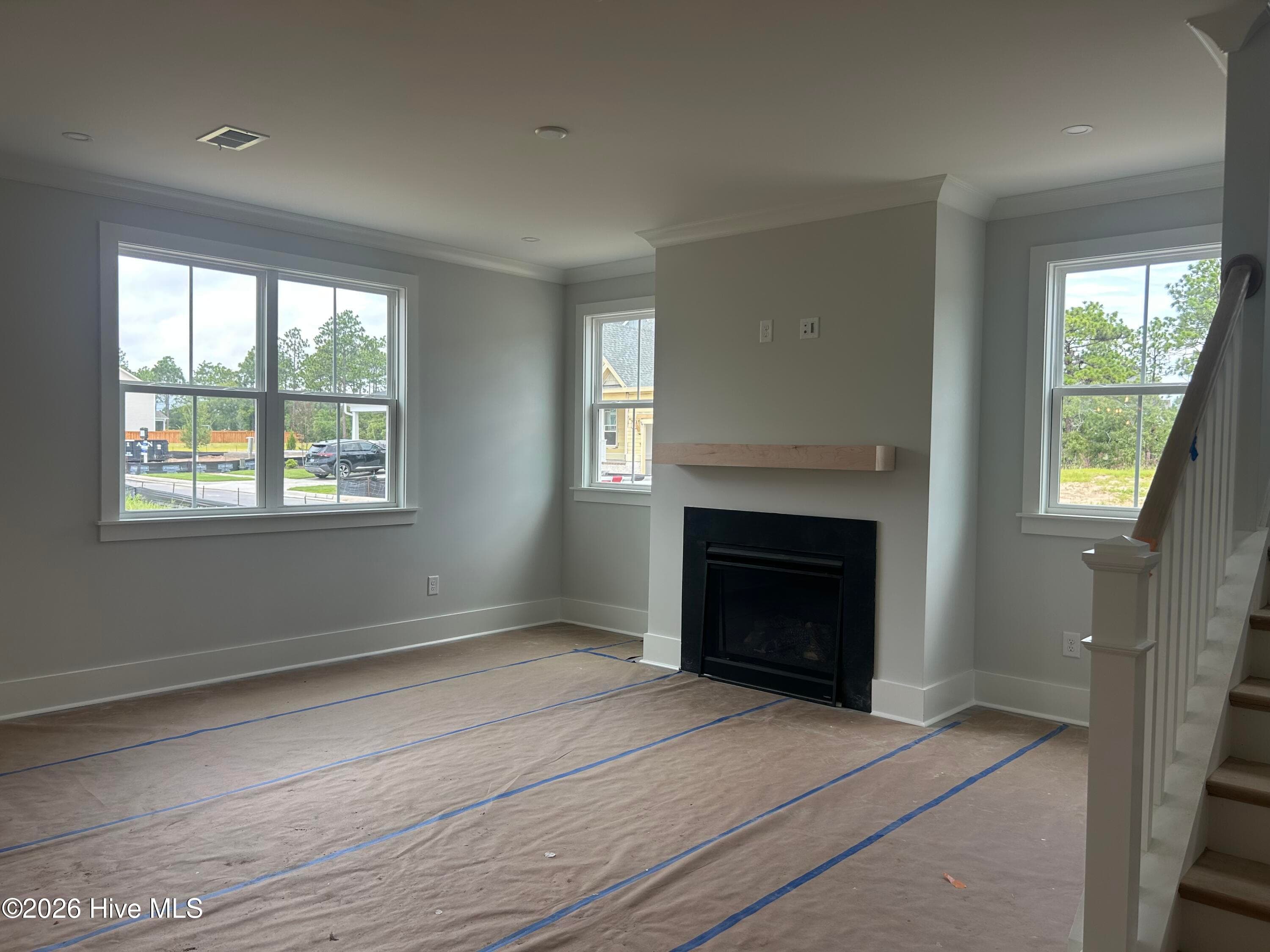 Living Room with natural gas fireplace - 5202 Moonshell Loop, Wilmington, NC 28412