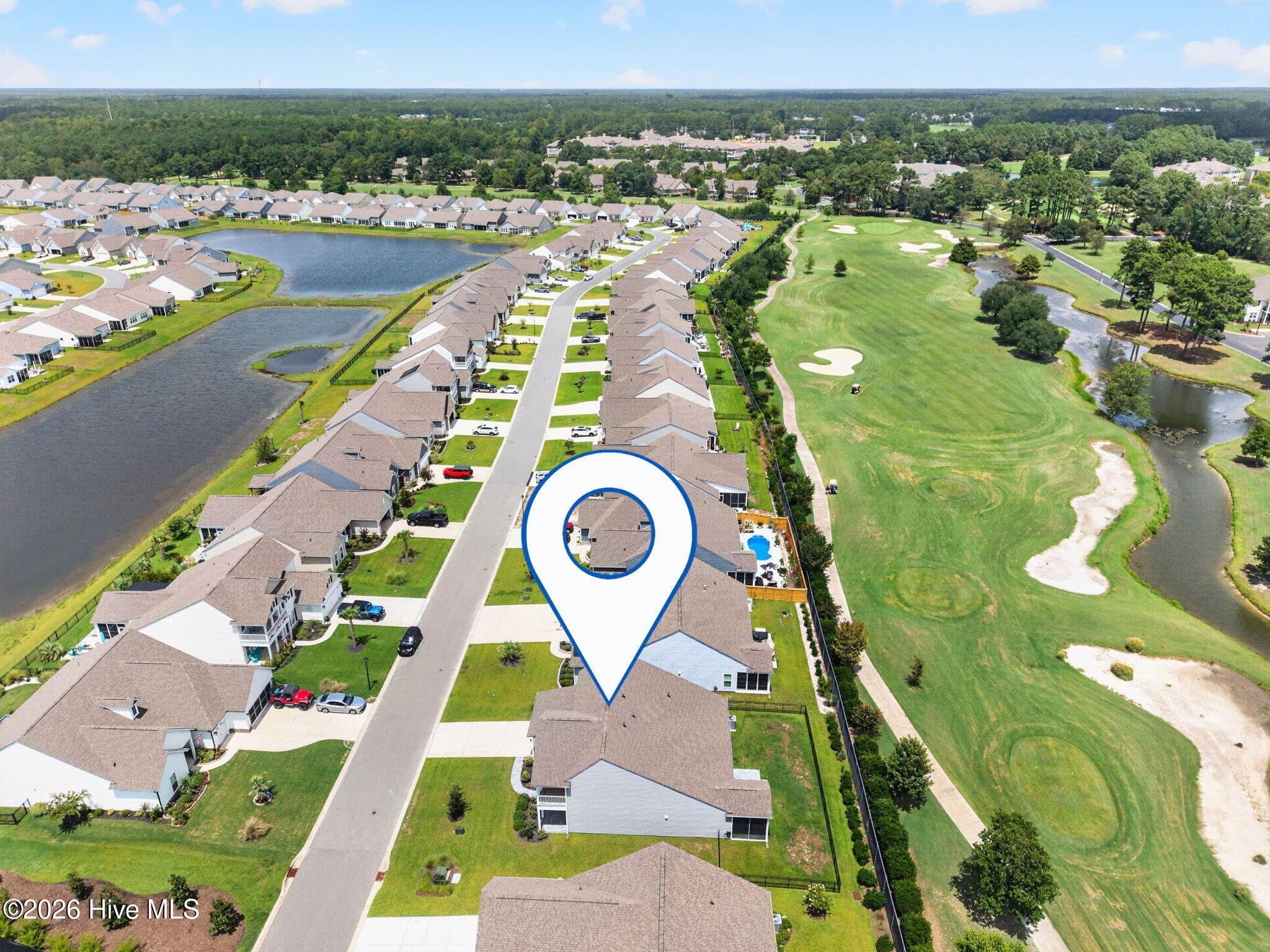 This aerial perspective highlights the property’s location beside the golf course in Calabash, North Carolina. - 139 Eagle Claw Drive, Calabash, NC 28467