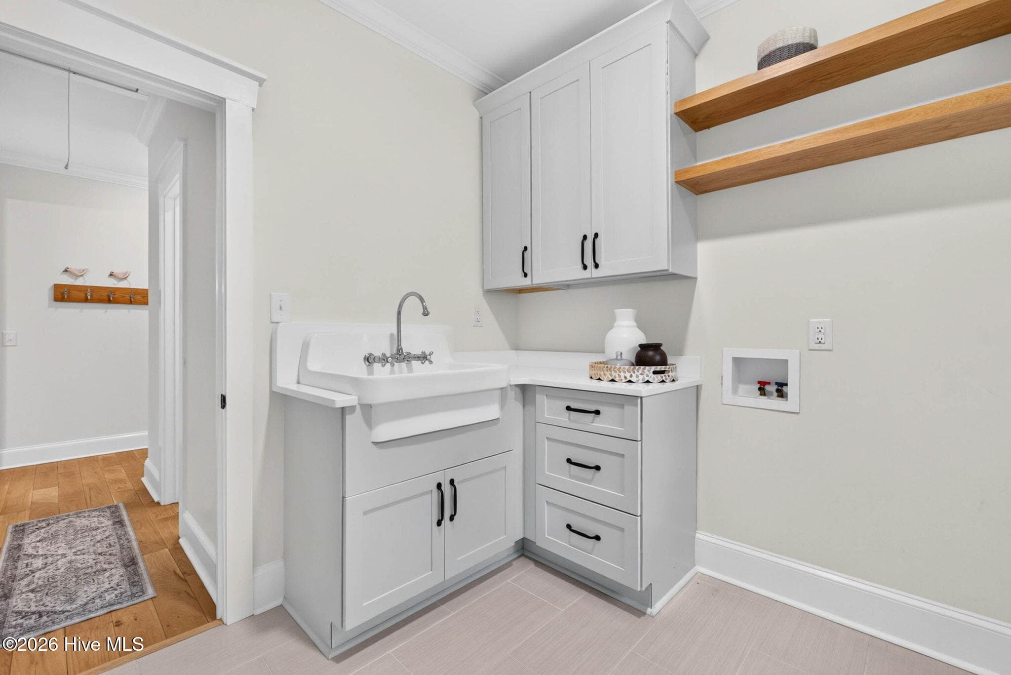 Laundry Room with Sink - 5933 Dutchman Creek Road, Southport, NC 28461