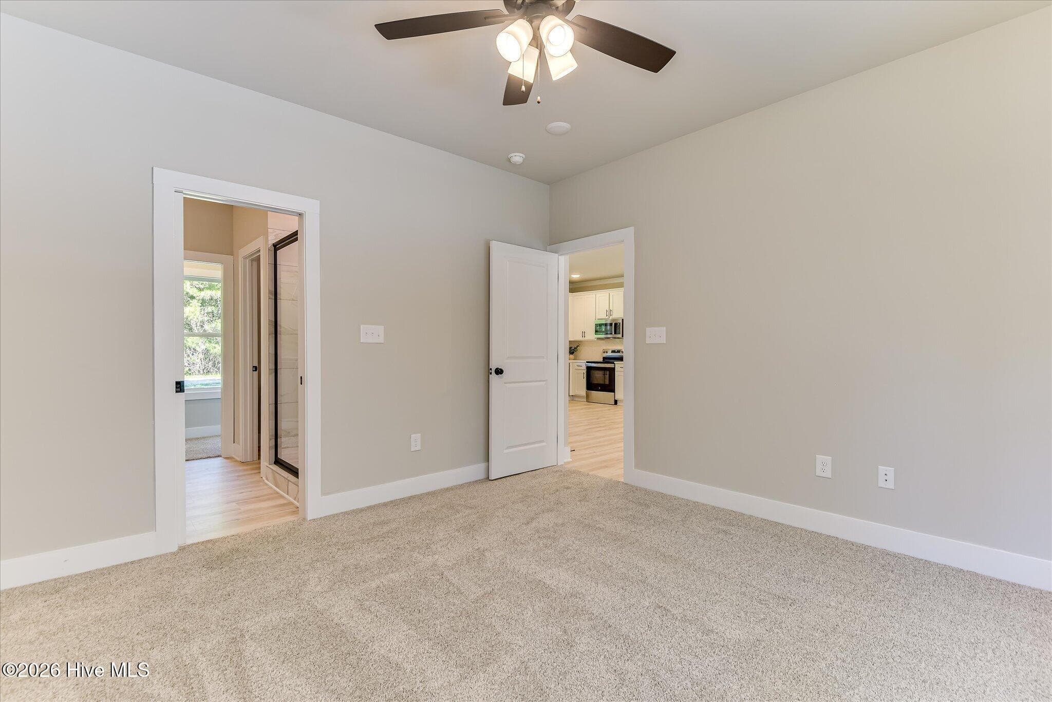 Primary Bedroom with large ensuite bathroom - 1198 Sunset Cove, Tignall, GA 30668