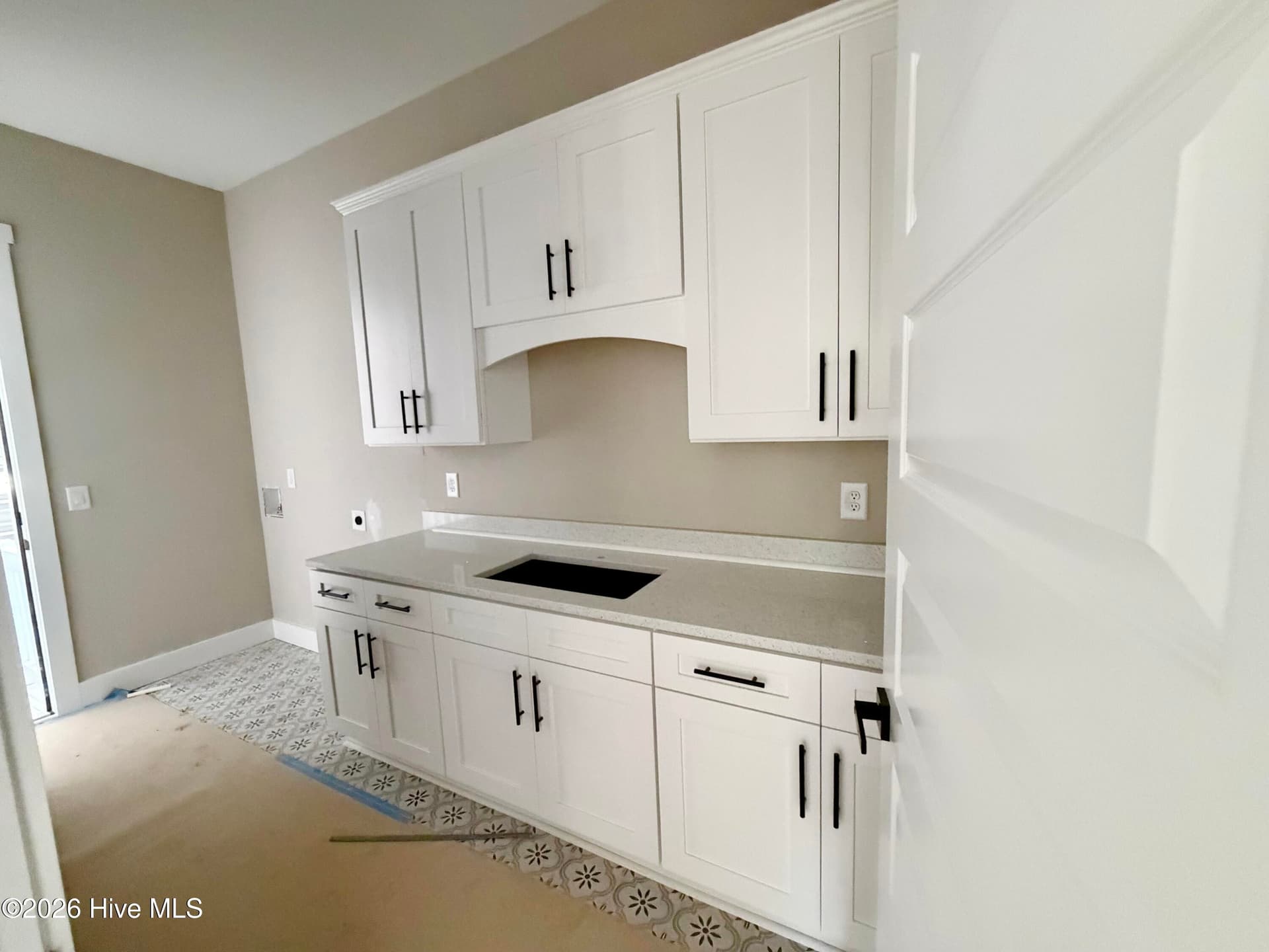 Laundry/mud room under construction. Custom tile. - 550 Glenburnie Street NW, Calabash, NC 28467