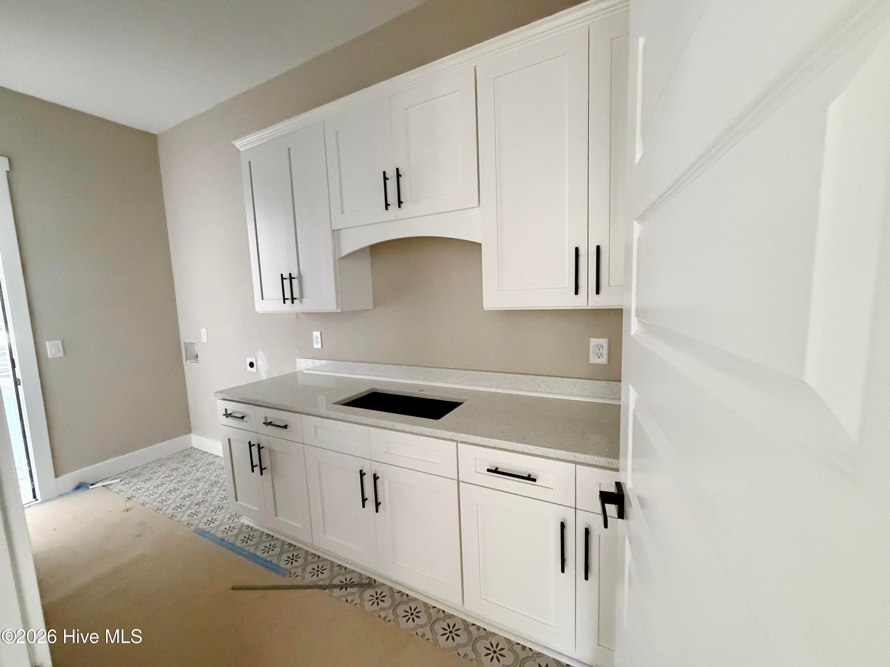 Laundry/mud room under construction. Custom tile. - 550 Glenburnie Street NW, Calabash, NC 28467