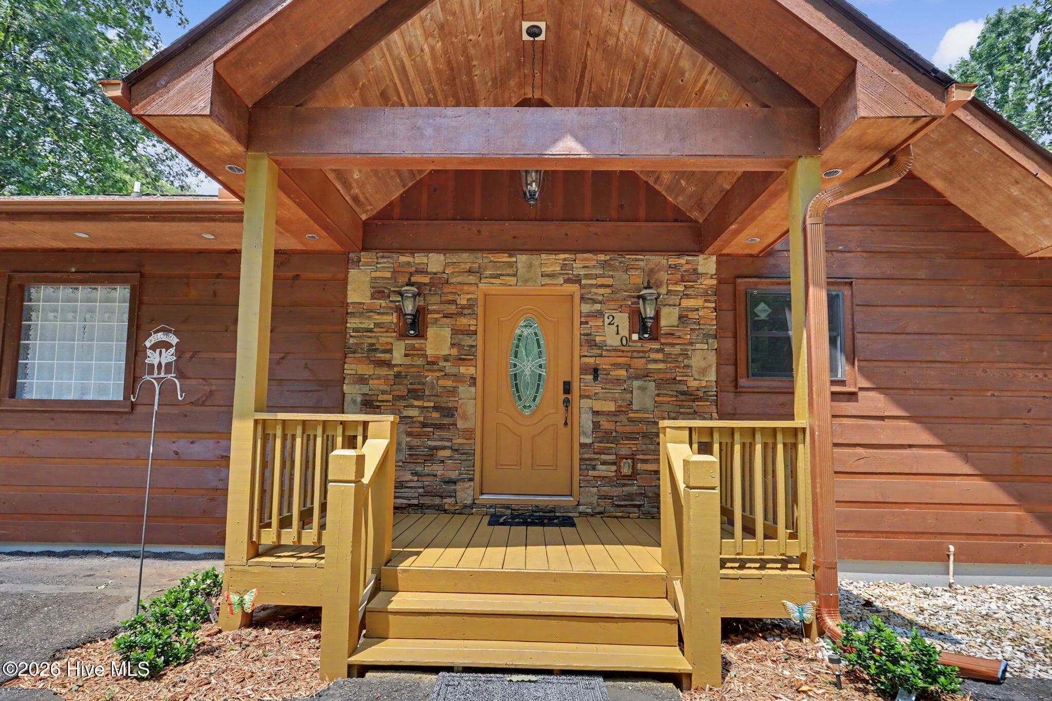 Covered front entry greets you and your guests. - 210 Majestic Drive, Hayesville, NC 28904