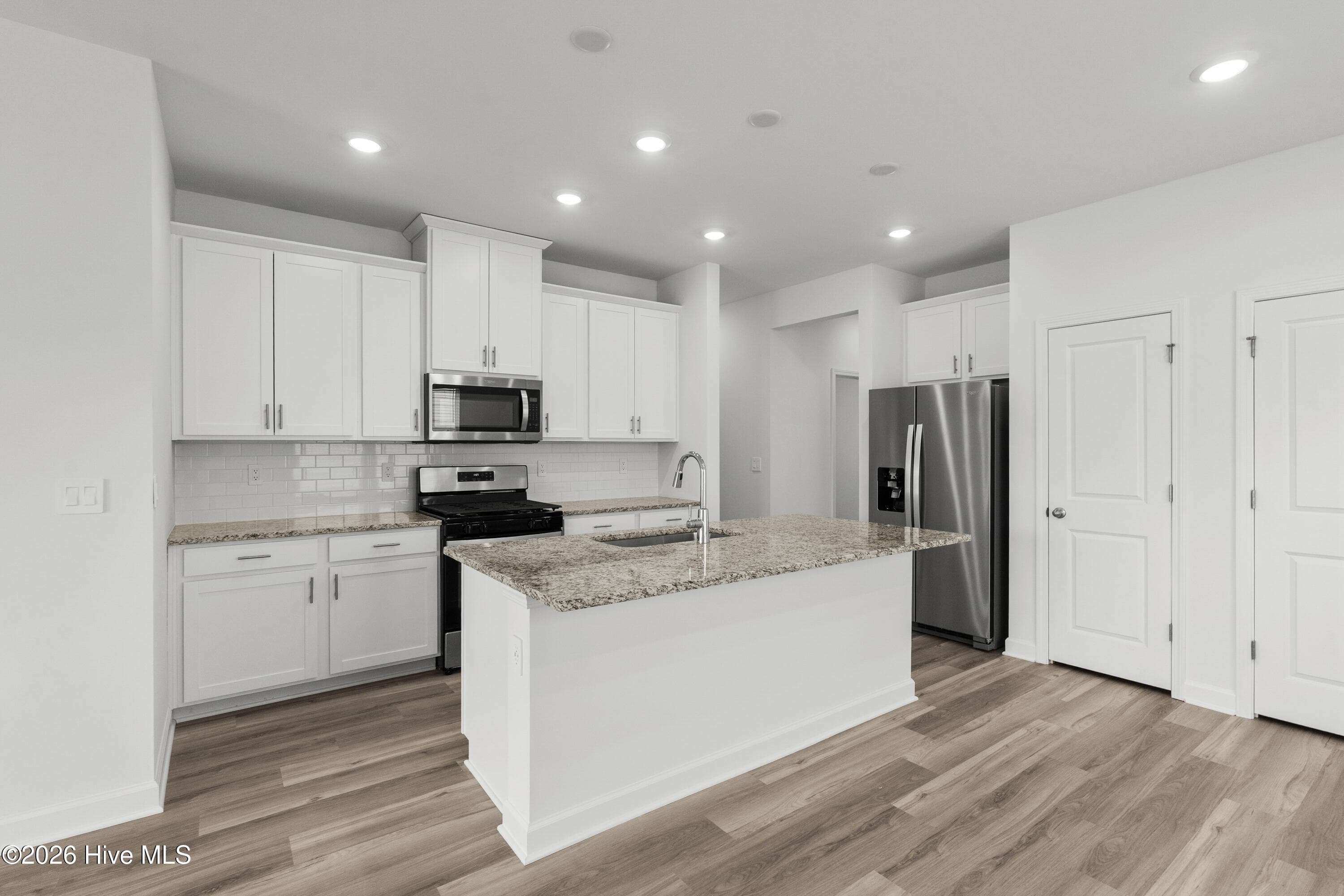 Photo is not of the actual home, but is an example photo of a completed home and may depict options and/or features that are not included - 2217 Lewis Allen Crossing NW, Ash, NC 28420