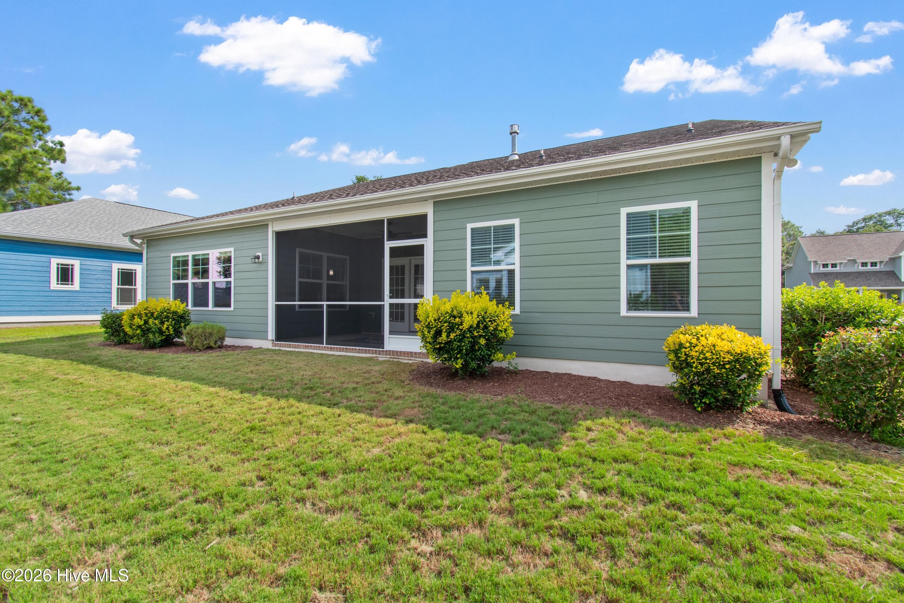 Backyard of home. Notice the screened porch! - 1674 Back Bay Drive SW, Shallotte, NC 28470