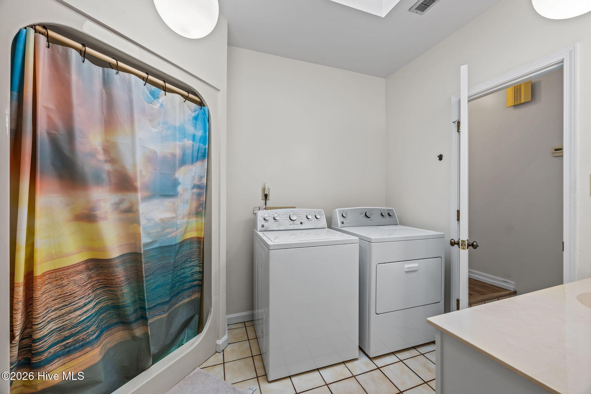 Laundry and guest bath - 135 Wilson Circle, Minnesott Beach, NC 28510