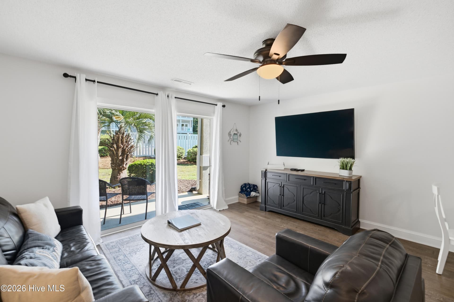 Living Room, Slider to Covered Patio, adjacent to Pool - 908 Resort Circle Unit 203, Sunset Beach, NC 28468