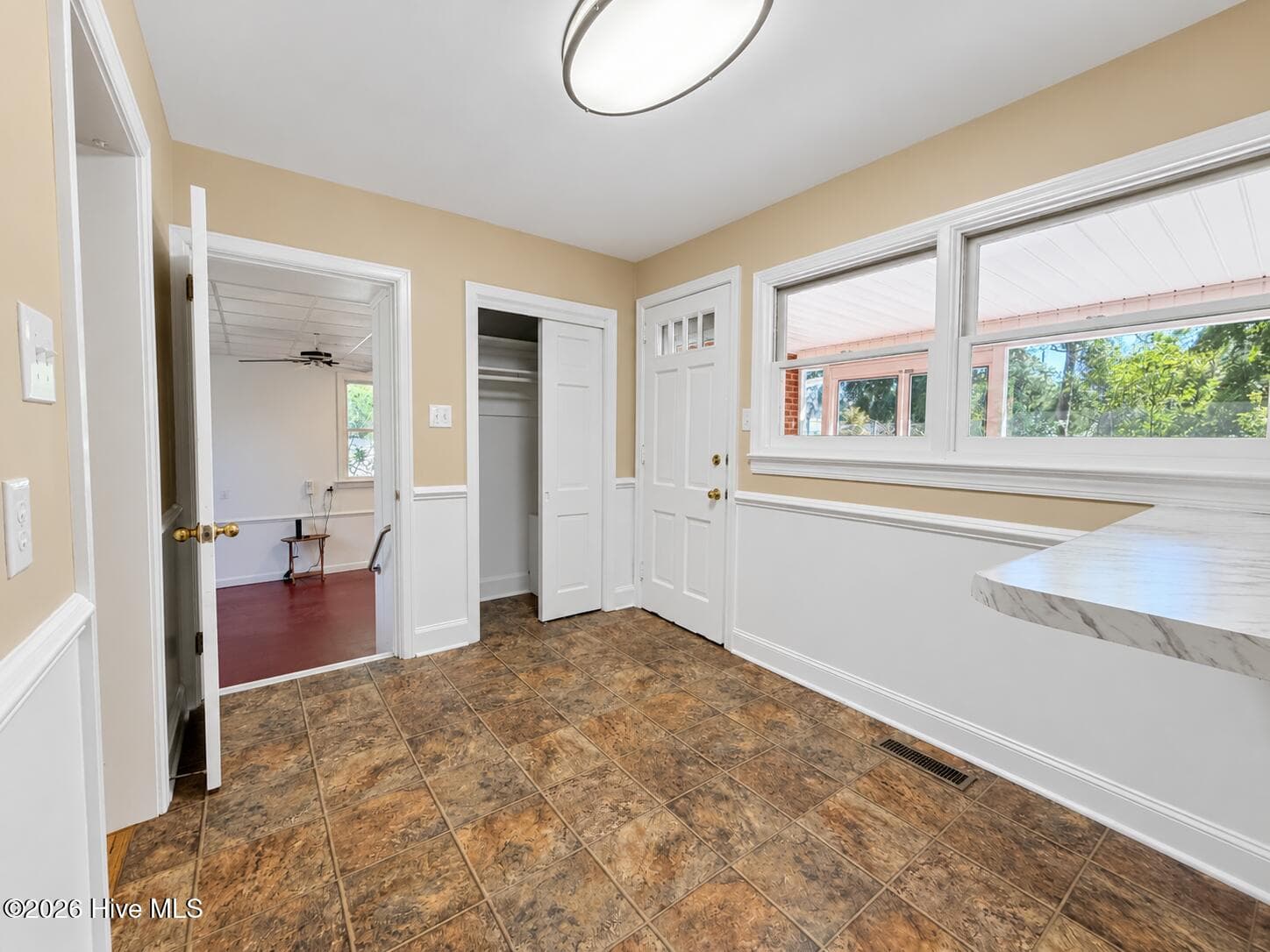 Door leading downstairs to the large flex room. Door to the left is the dining, to the right is the screened porch. - 320 Northern Boulevard, Wilmington, NC 28401