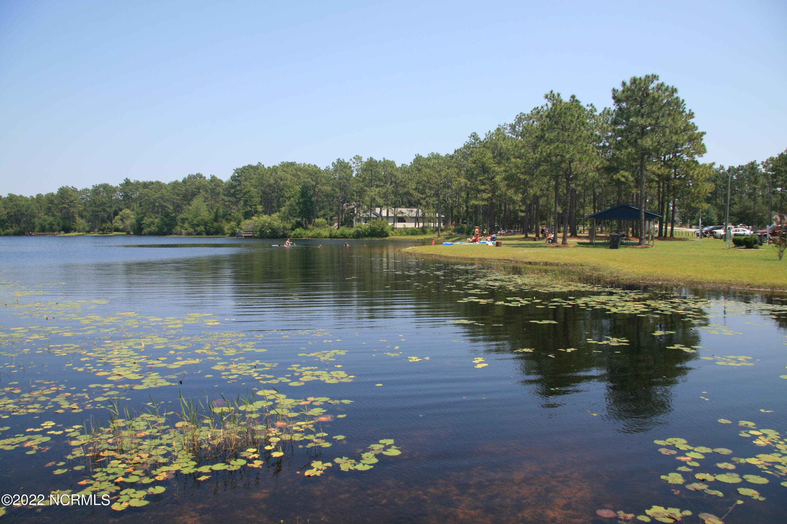 Spring Lake is close by for swimming, picnicking and relaxation. - 27 N High Point Road, Southport, NC 28461