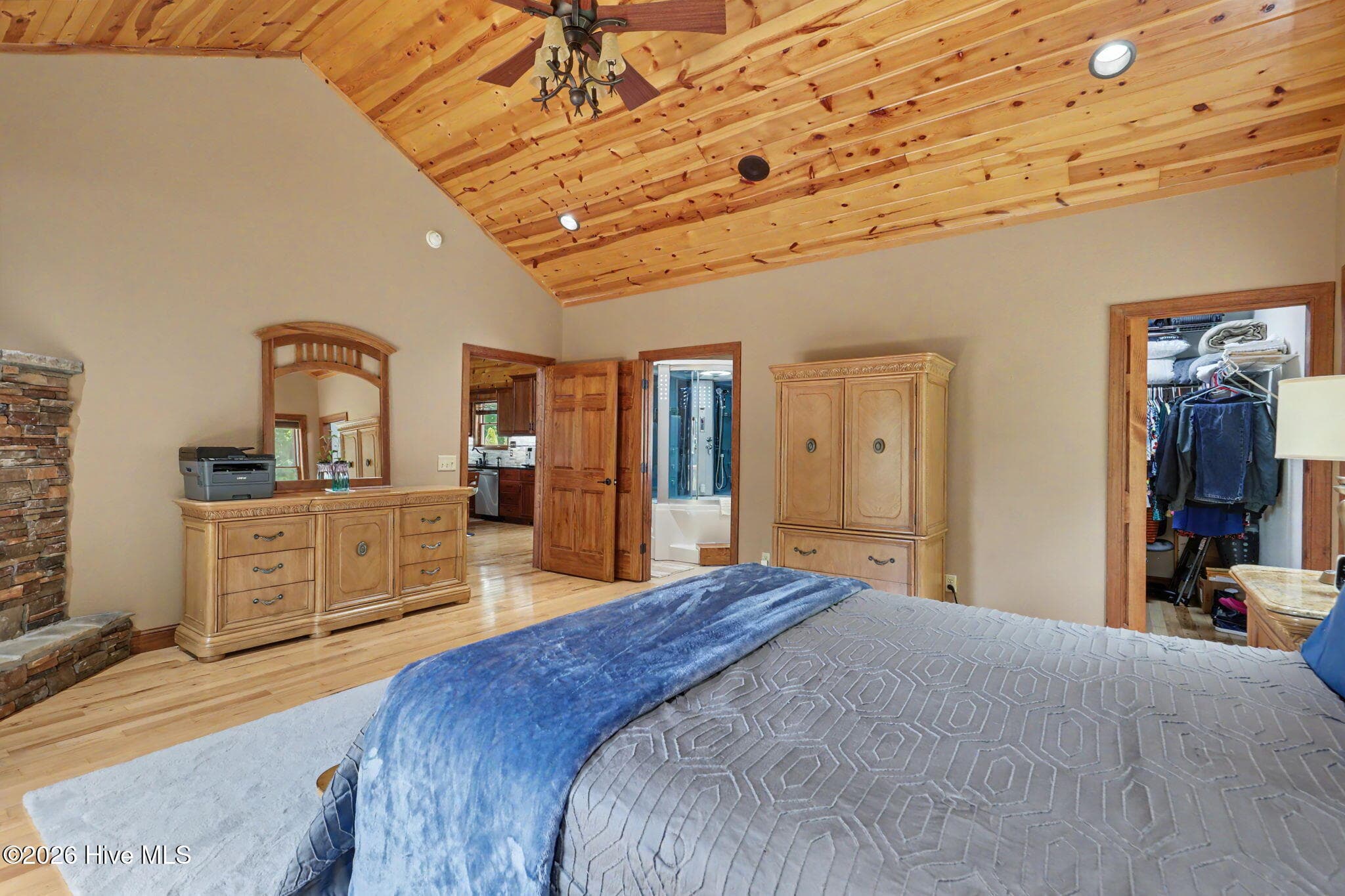 Primary suite offers convenient access to the en suite bath and walk-in closet. - 210 Majestic Drive, Hayesville, NC 28904