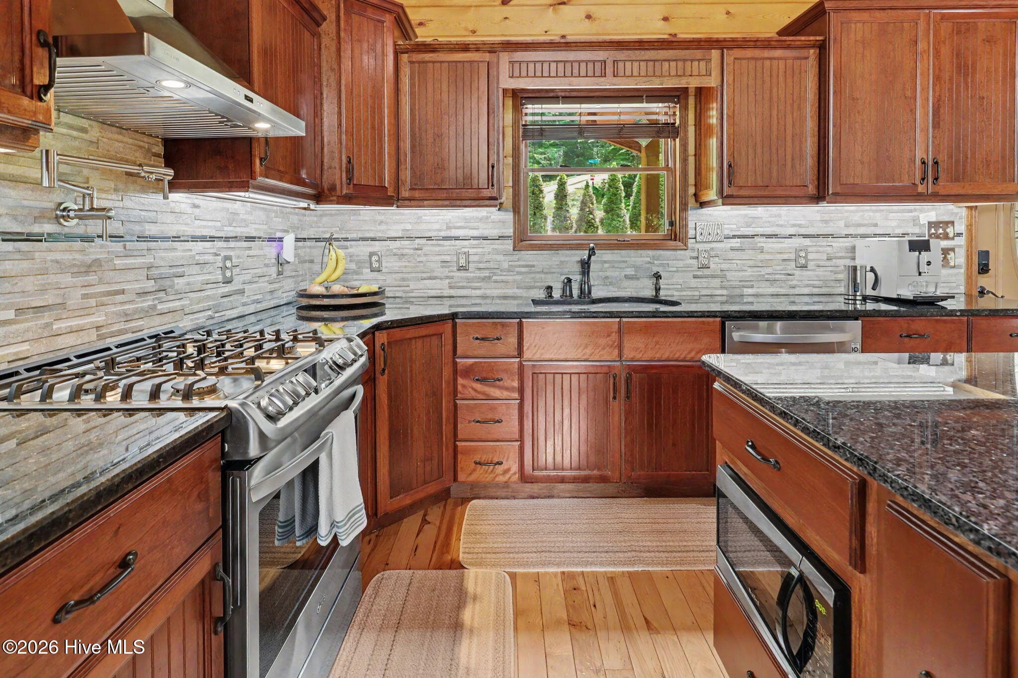 Gas range, pot filler and designer backsplash for the serious chef. - 210 Majestic Drive, Hayesville, NC 28904