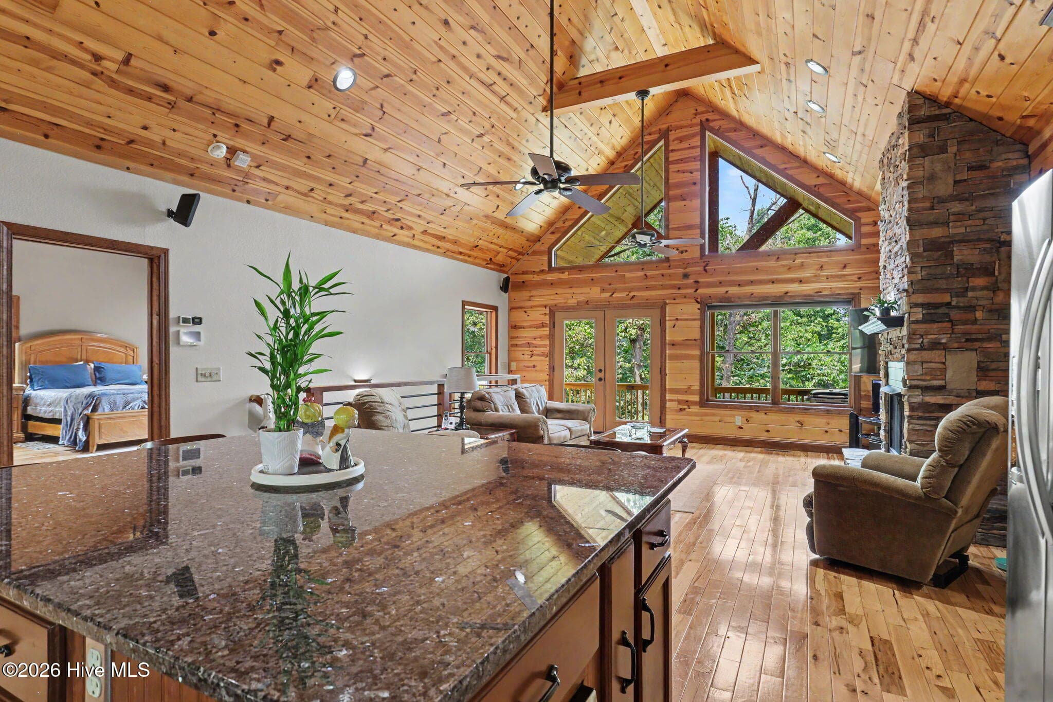 Large granite island overlooks the light-filled main living area. - 210 Majestic Drive, Hayesville, NC 28904