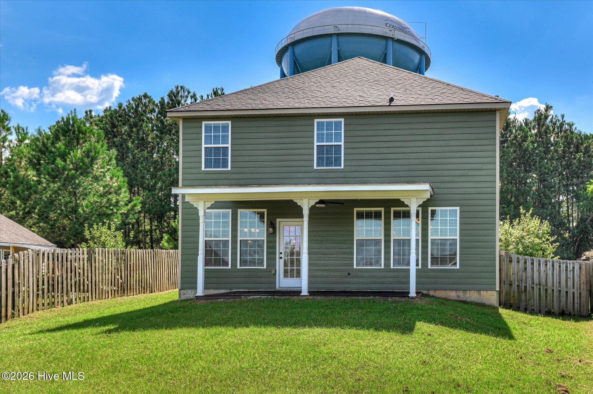This water tower is not in the yard. There is no flying object near. It looks close but, is well across the street. - 3054 Margot Lane, Grovetown, GA 30813