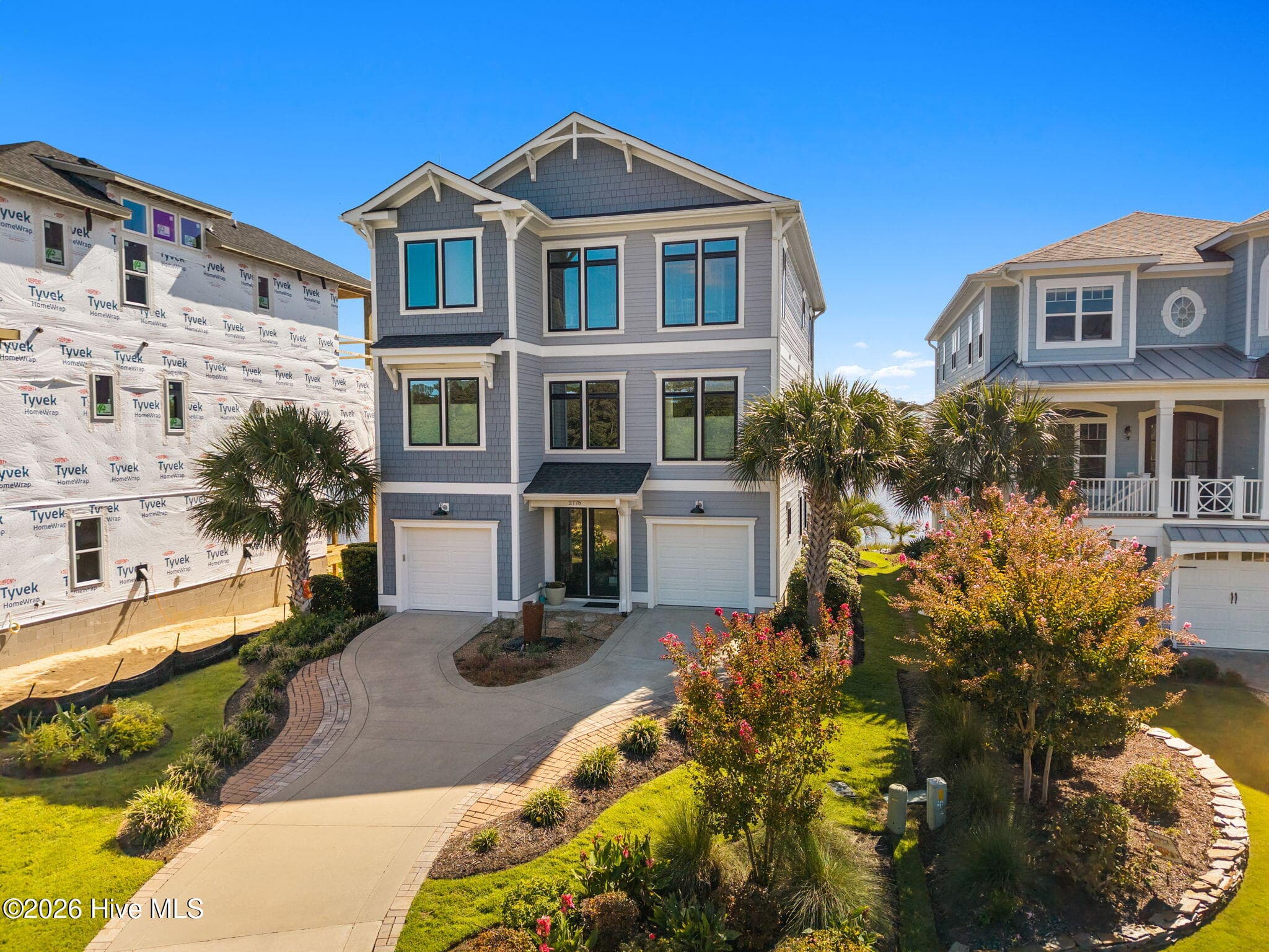 Note mature, colorful landscaping in front of home - 2775 Long Bay Drive SE, Southport, NC 28461