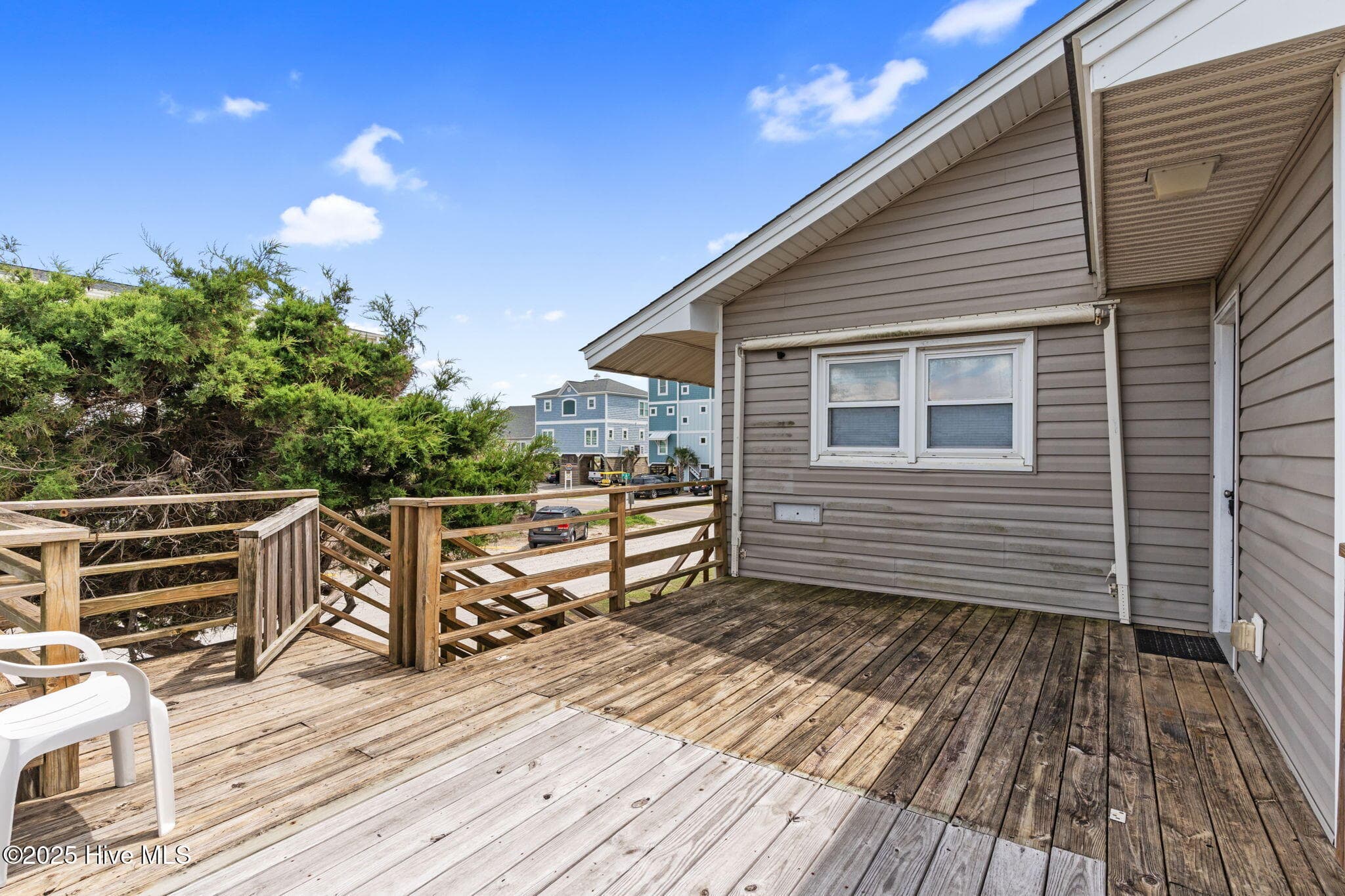 Single Family Residence at 930 E Beach Drive, Oak Island, NC 28465, photo 2 of 3
